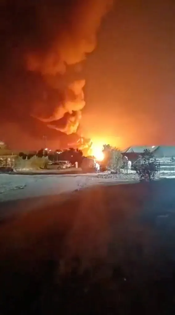 Smoke rises from an explosion near Ali Al Salem Air Base in Al Jahra.