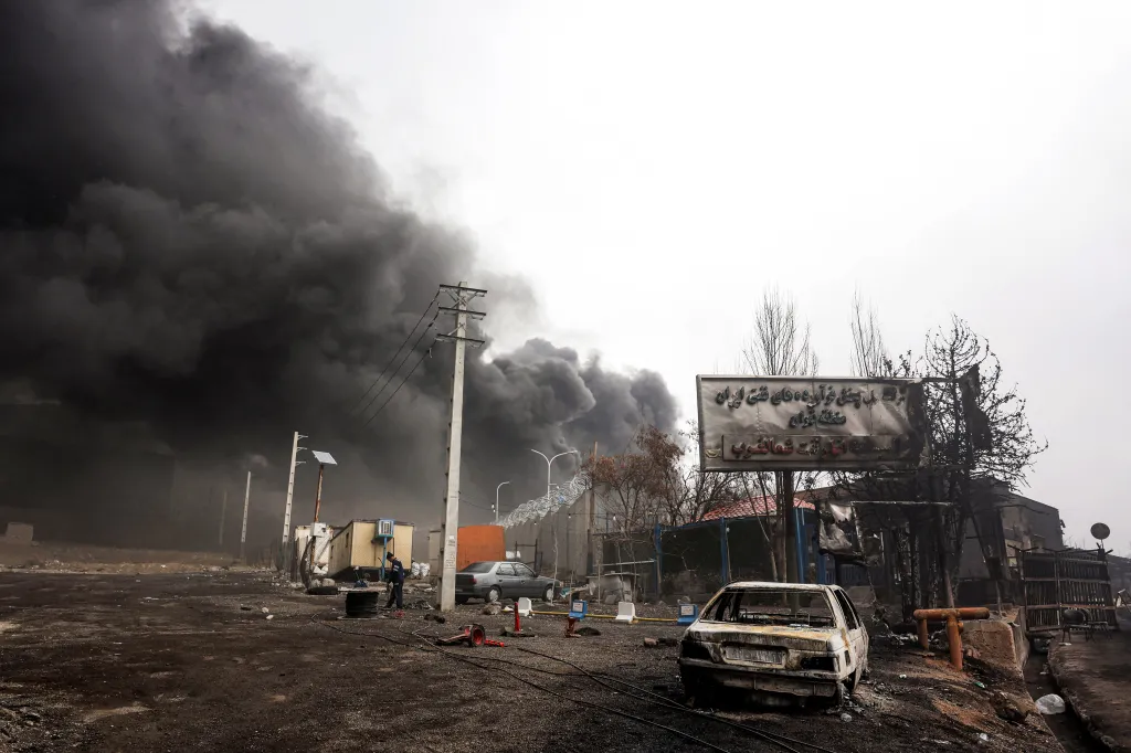 Smoke plumes from an ongoing fire at the Shahran oil refinery in Tehran.