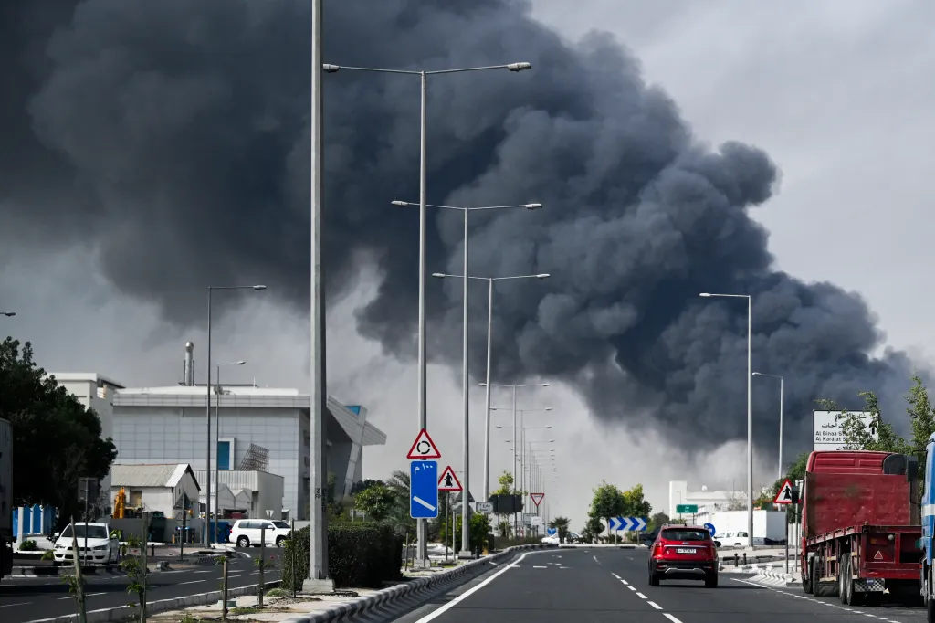 A thick, dark plume of smoke rises into the air after an Iranian strike in the industrial district of Doha, Qatar, on March 1, 2026.