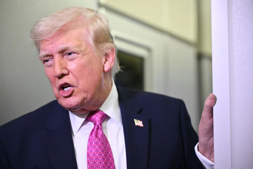 Donald Trump speaking to reporters aboard Air Force One.