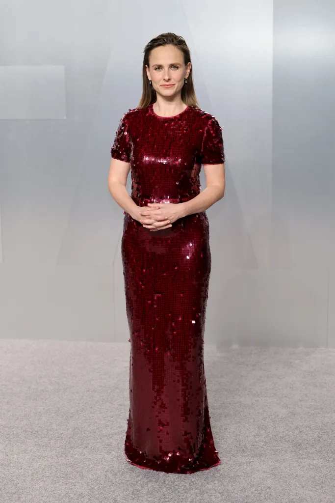 Pauline Chalamet in a shimmering red sequin gown.