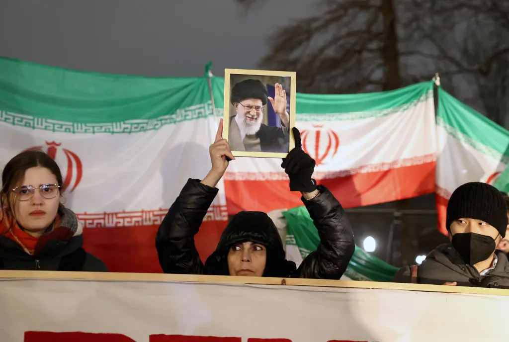 A woman holds up a photo of executed Iranian Supreme Leader Ayatollah Ali Khamenei during a protest against the US Operation Epic Fury outside the White House on March 2, 2026.