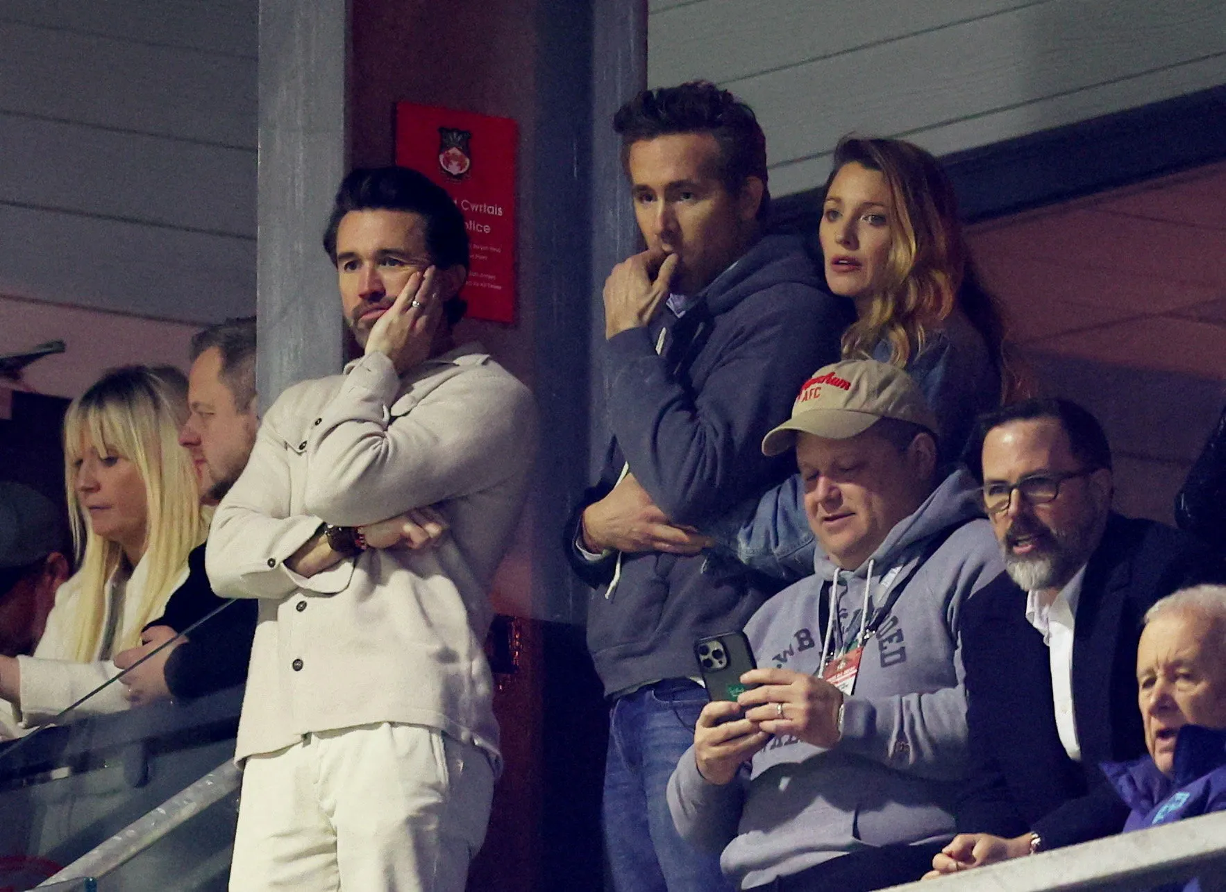 Rob McElhenney, Ryan Reynolds, and Blake Lively in the stands at the FA Cup Fifth Round Wrexham v Chelsea match.