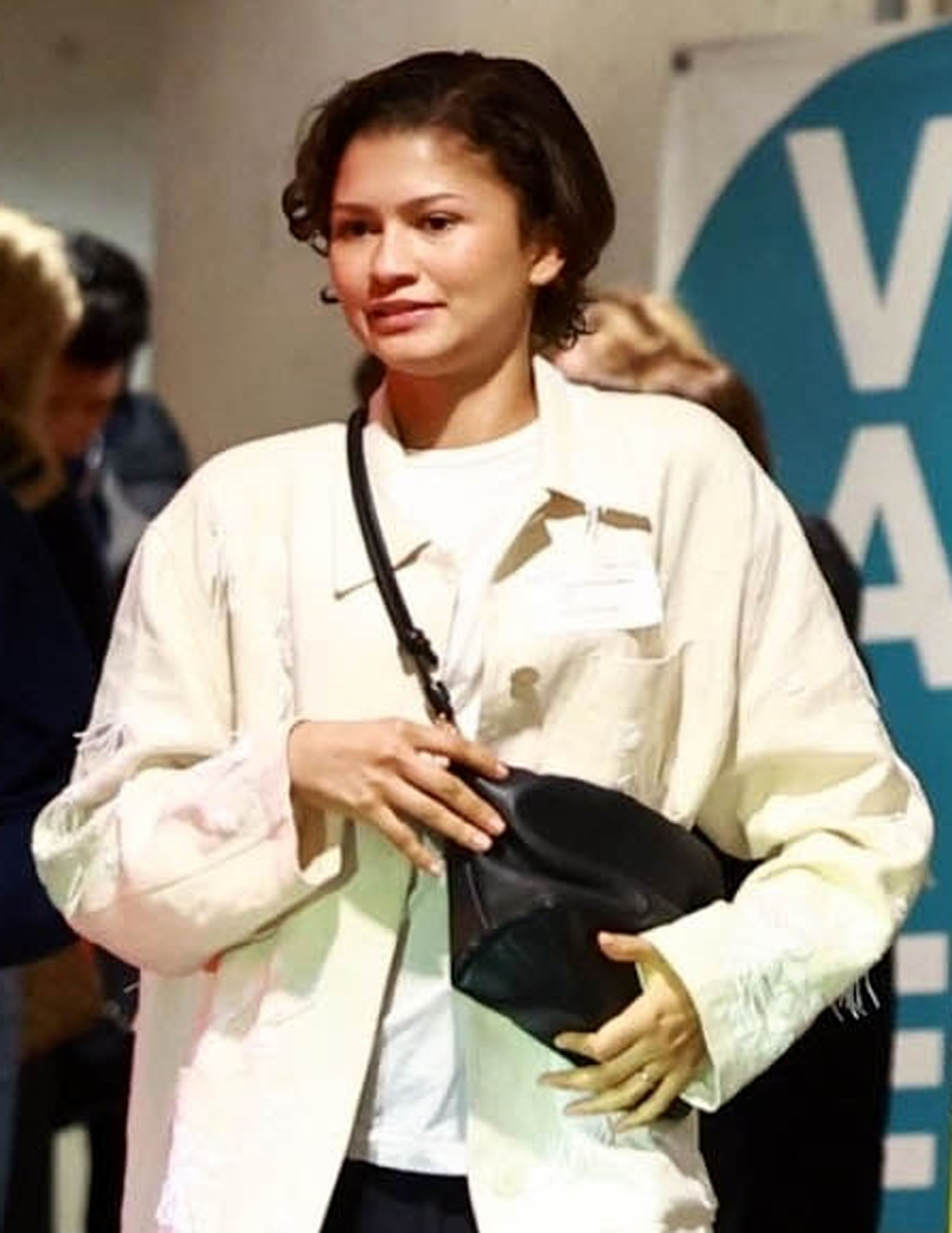 Zendaya wearing a gold band on her left ring finger, fueling speculation of marriage to Tom Holland.