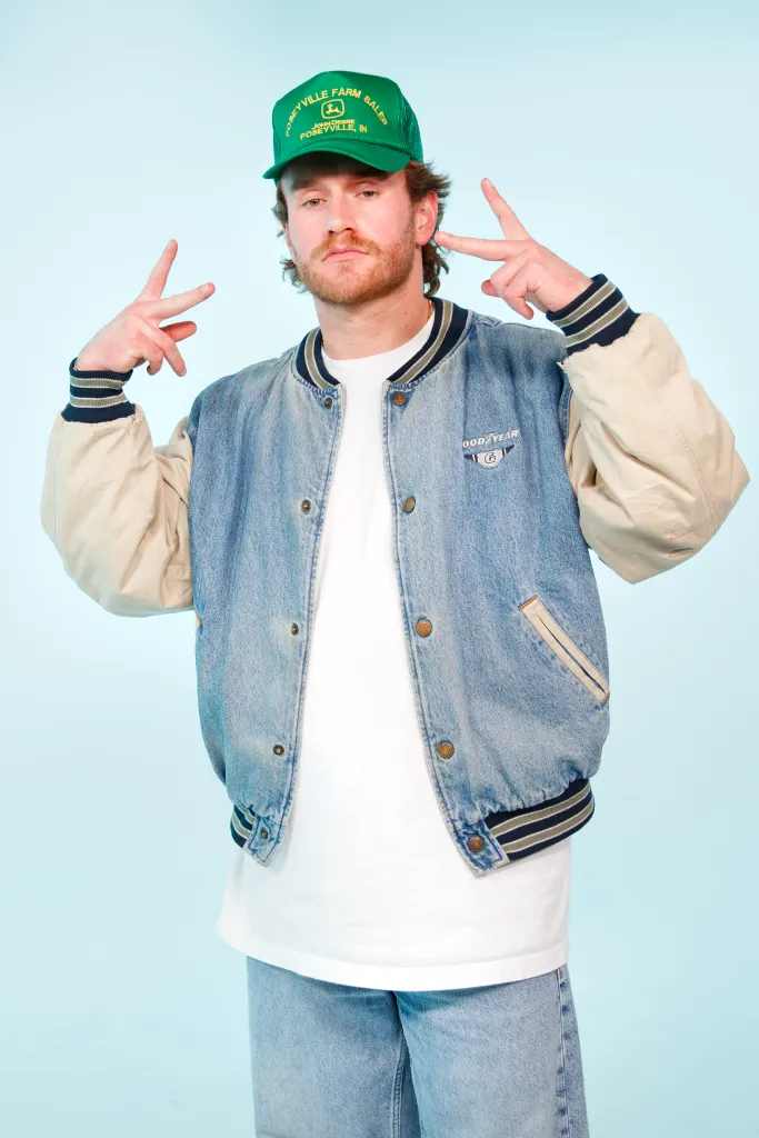 West Wilson giving peace signs to the camera.