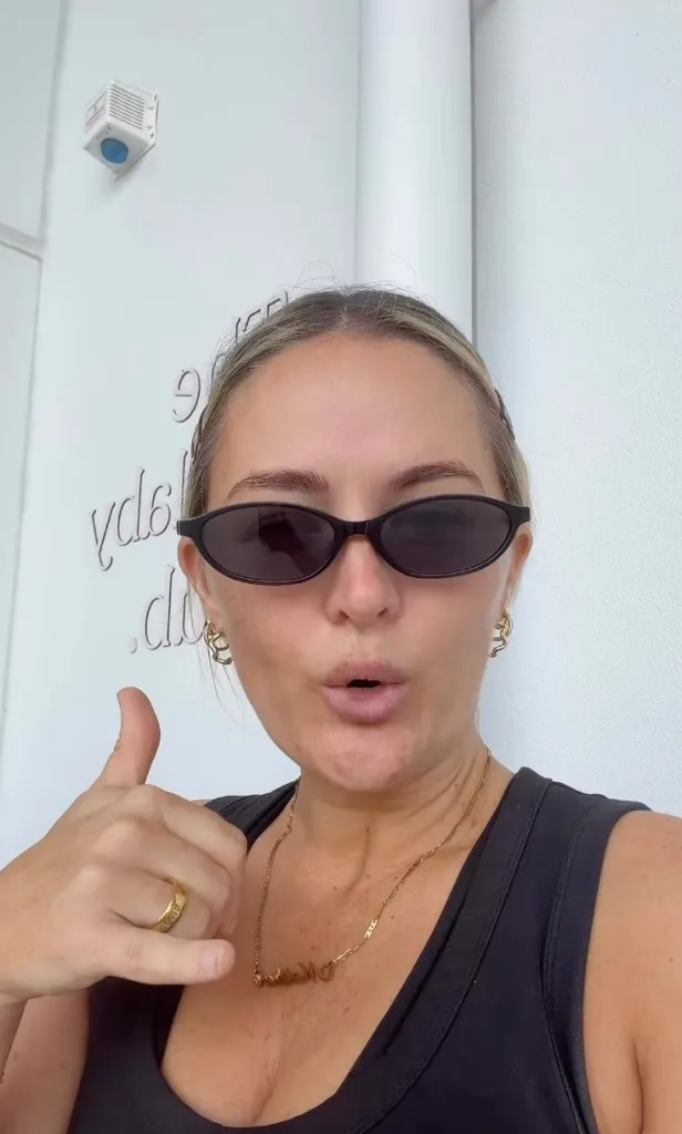 Marisa Taschke wearing sunglasses and making a