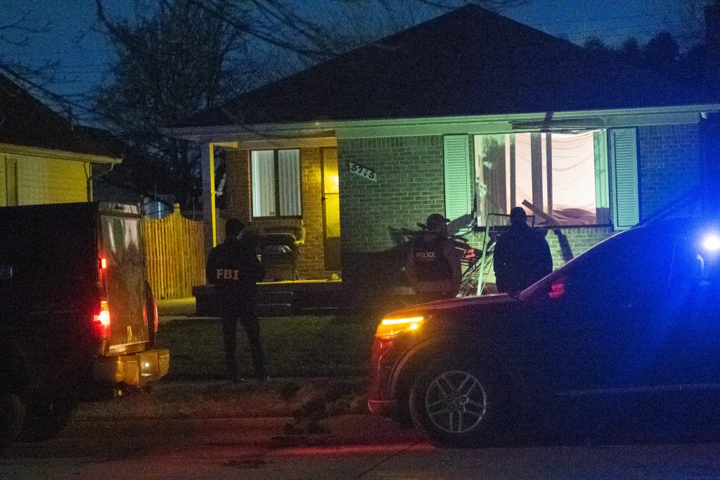 FBI and police at 5715 N Gully Rd. in Dearborn, MI.