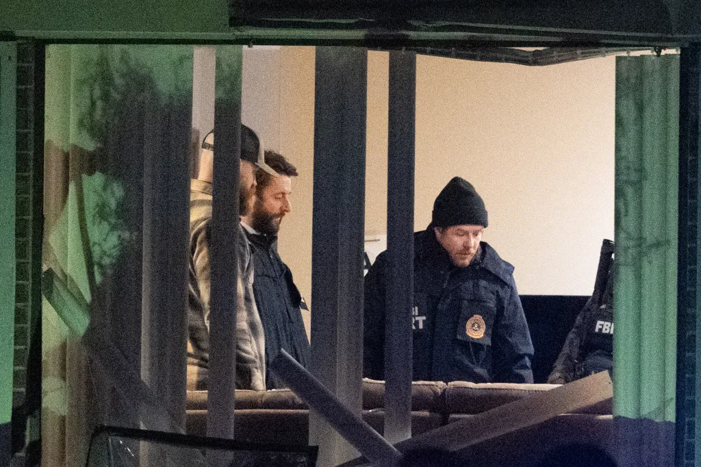 FBI agents inside a residence.