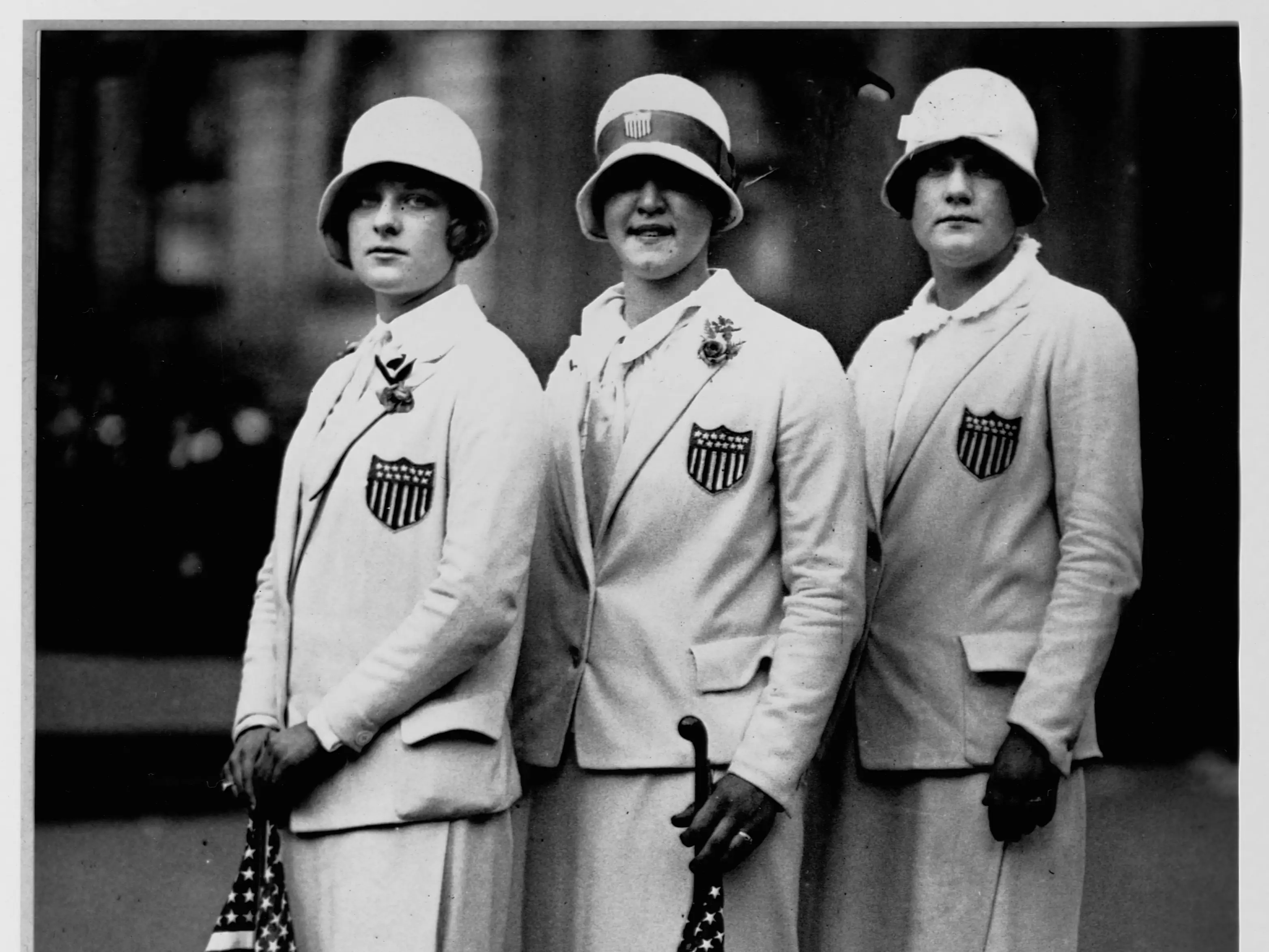 US Olympic swimmers Aileen Riggin, Gertrude Ederle, and Helen Wainright posed in uniform.