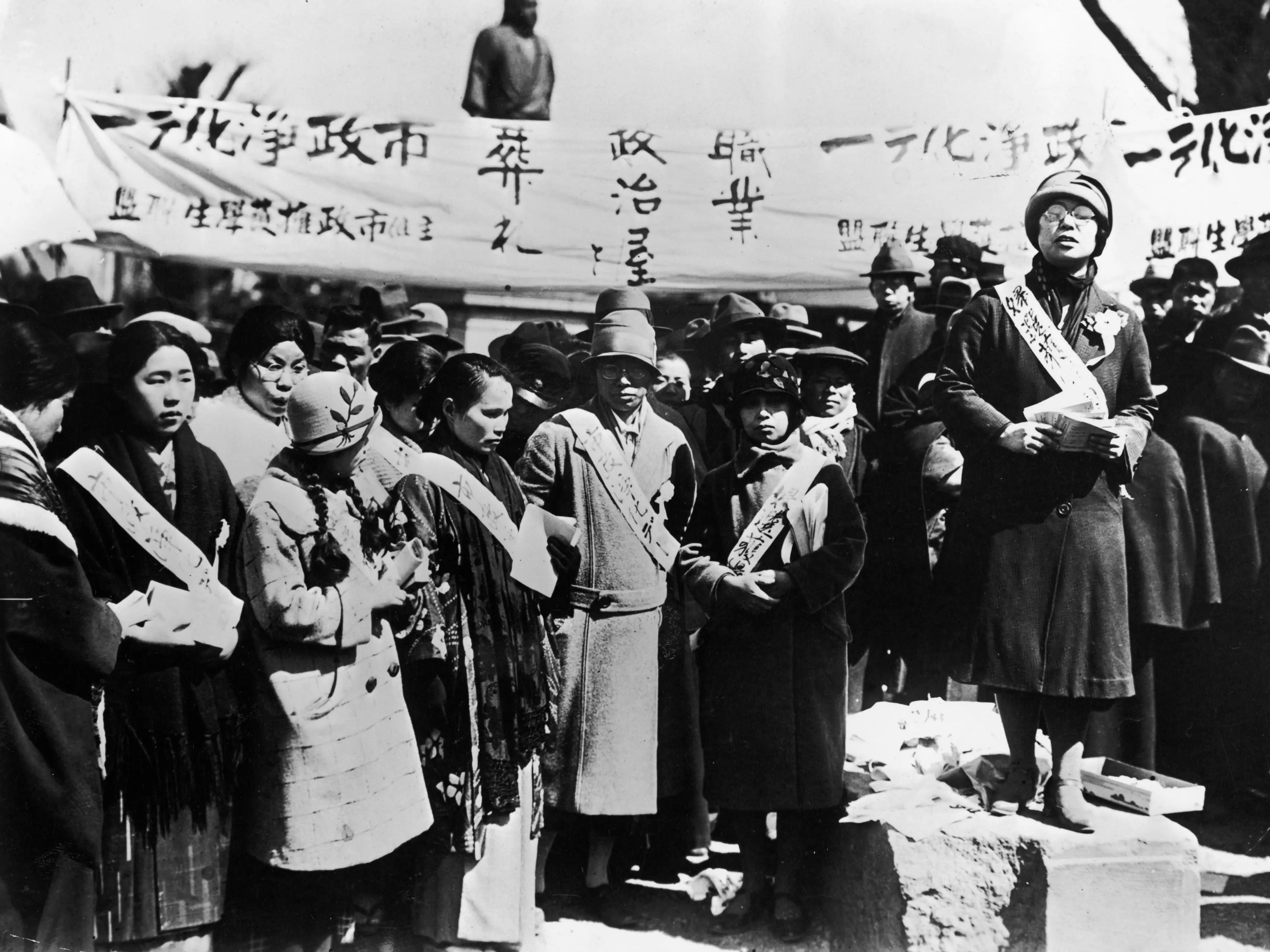 Japanese women holding a demonstration to protest low wages paid to female factory workers.