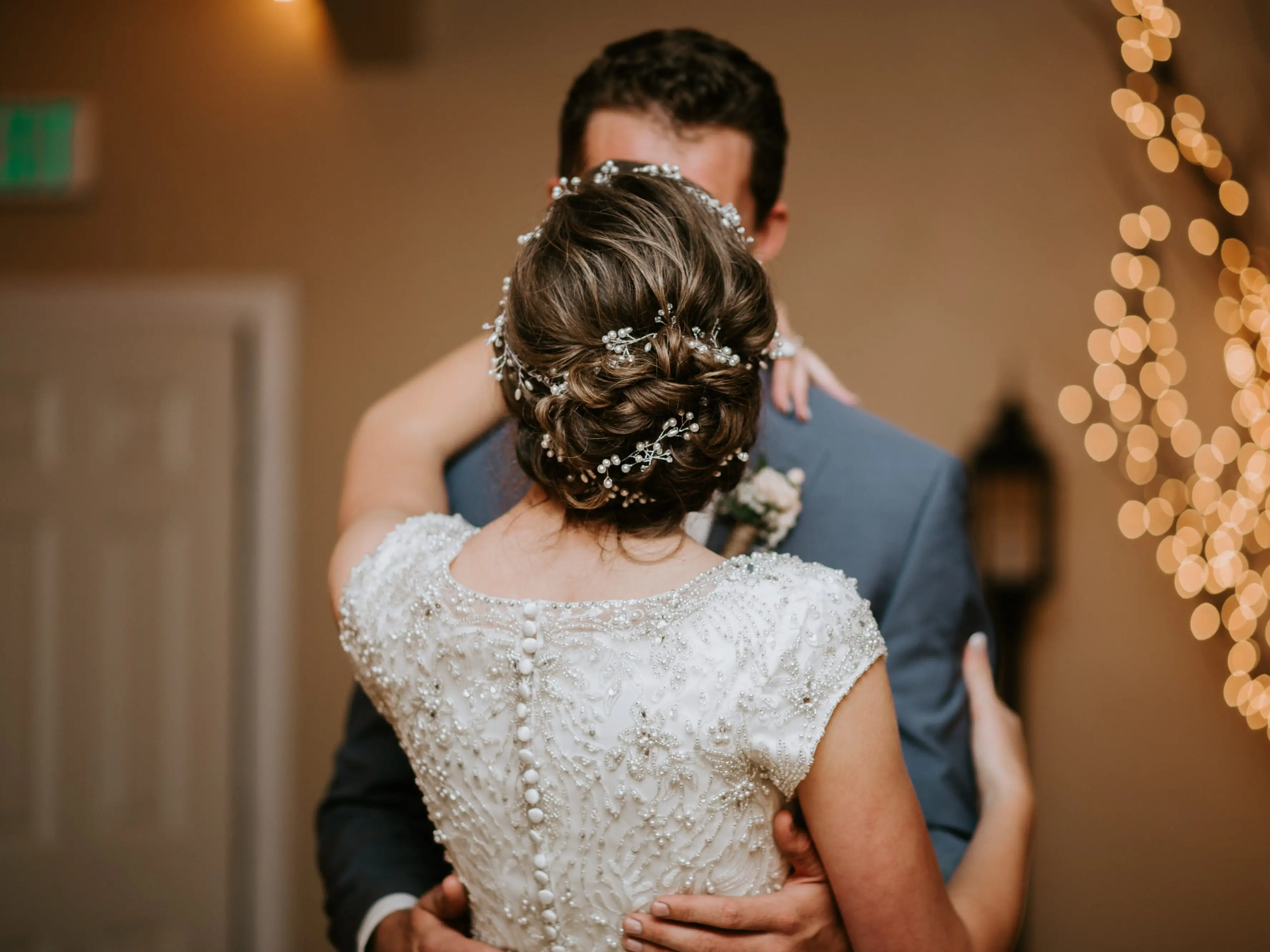 bride and groom having their first dance together at a wedding