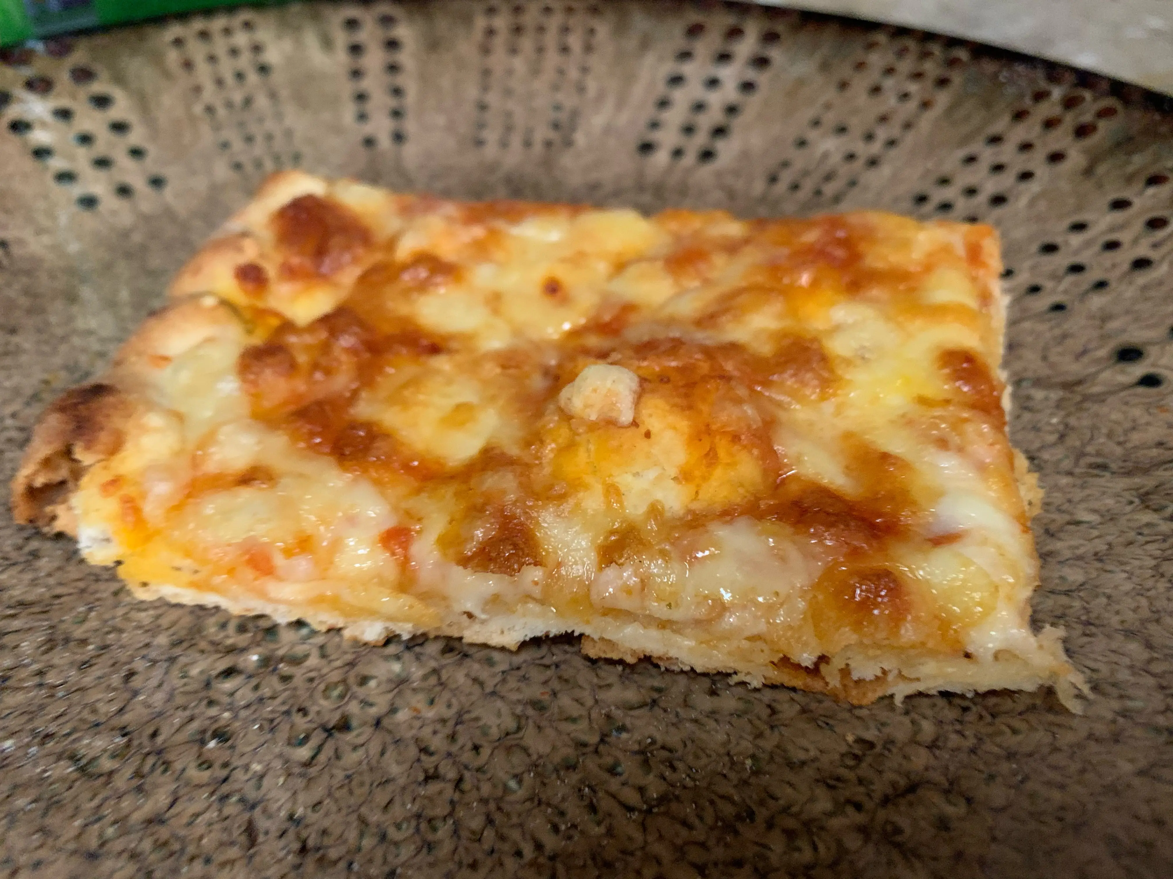 slice of Trader Joe's cheese and tomato family sized pizza