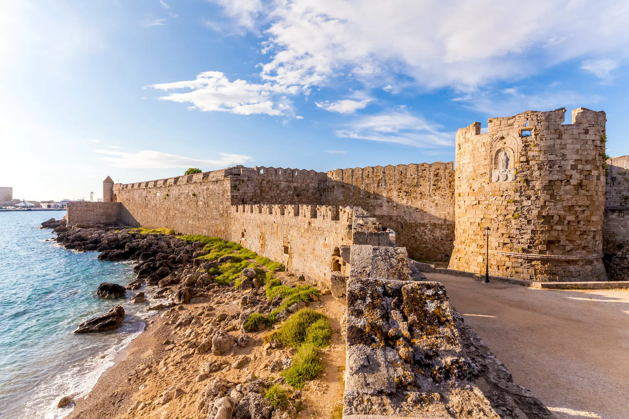 A castle wall by the ocean.