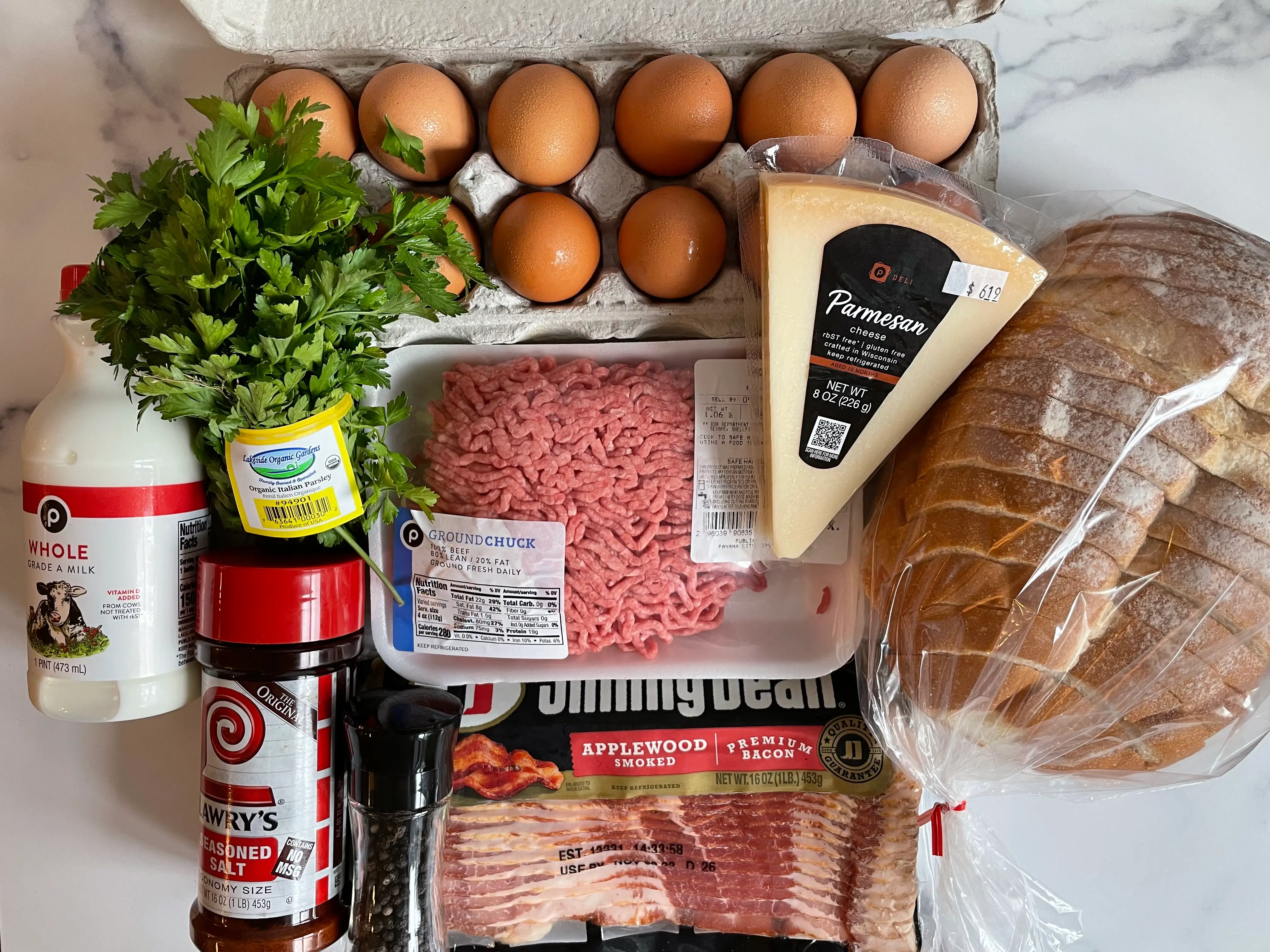Meatloaf ingredients on a marble surface.