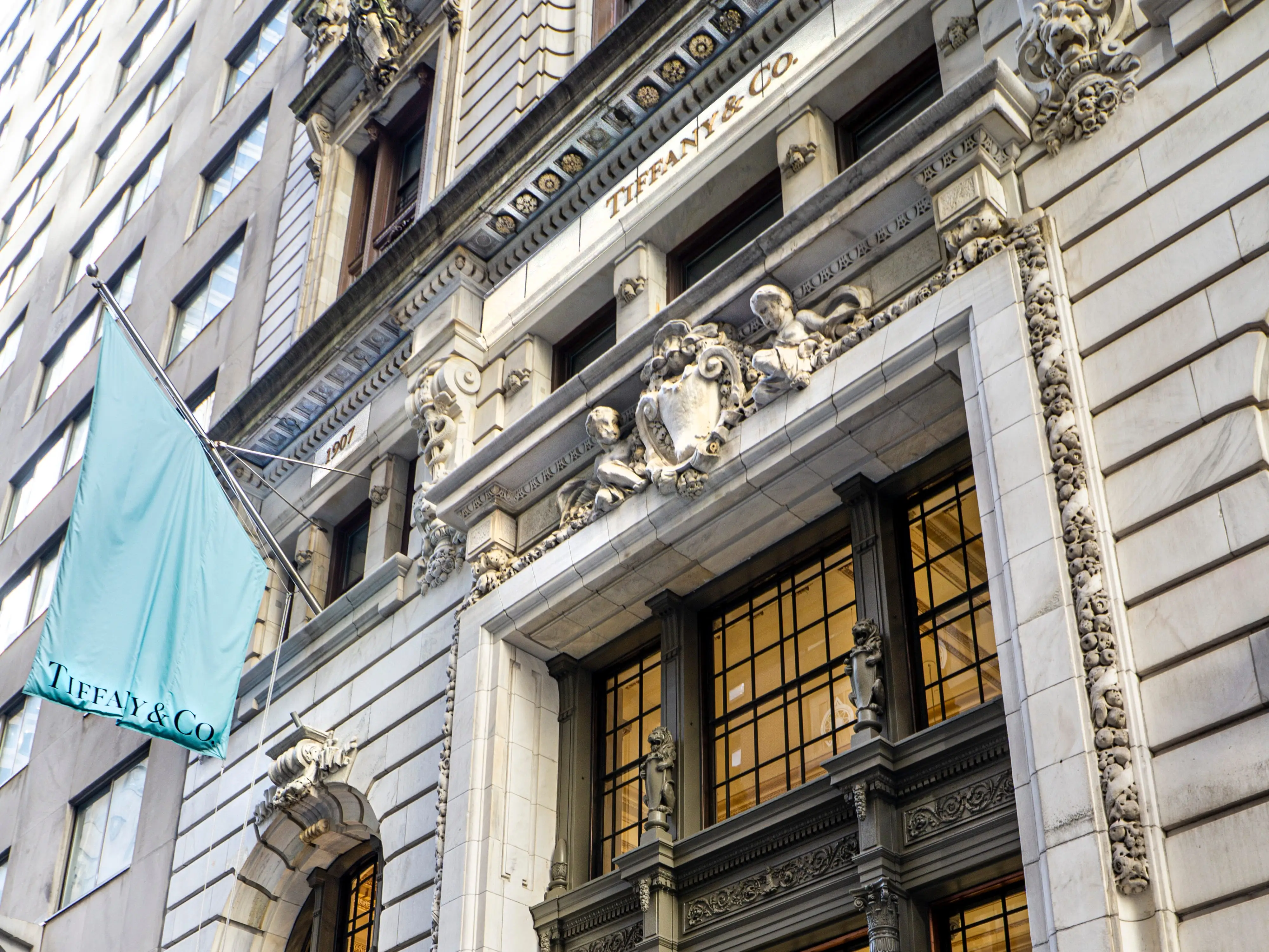 Tiffany and Co. storefront with Tiffany Blue flag hanging.