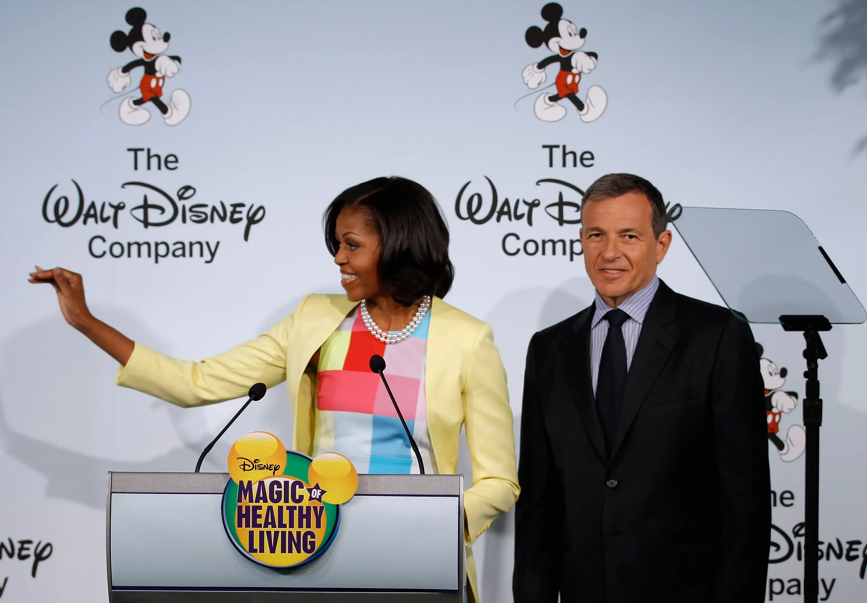 US First Lady Michelle Obama (L) joins The Walt Disney Company Chairman and CEO Robert Iger during an event introducing Disney's new 