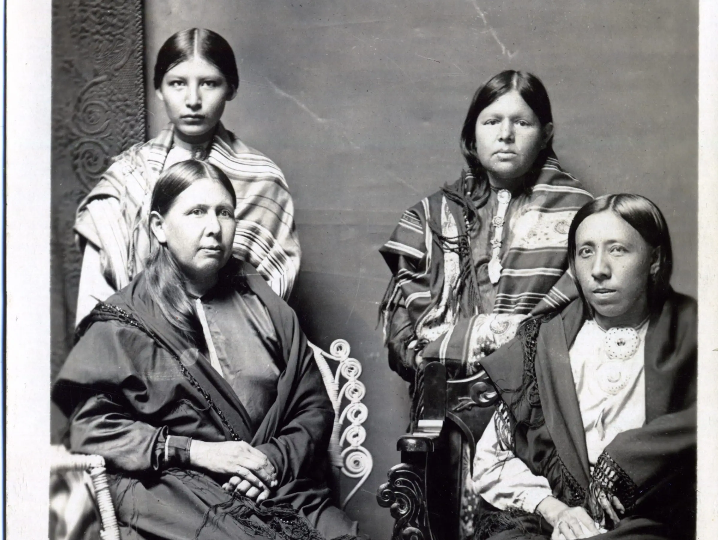 A portrait of an Osage woman and her three children circa 1918-1922.