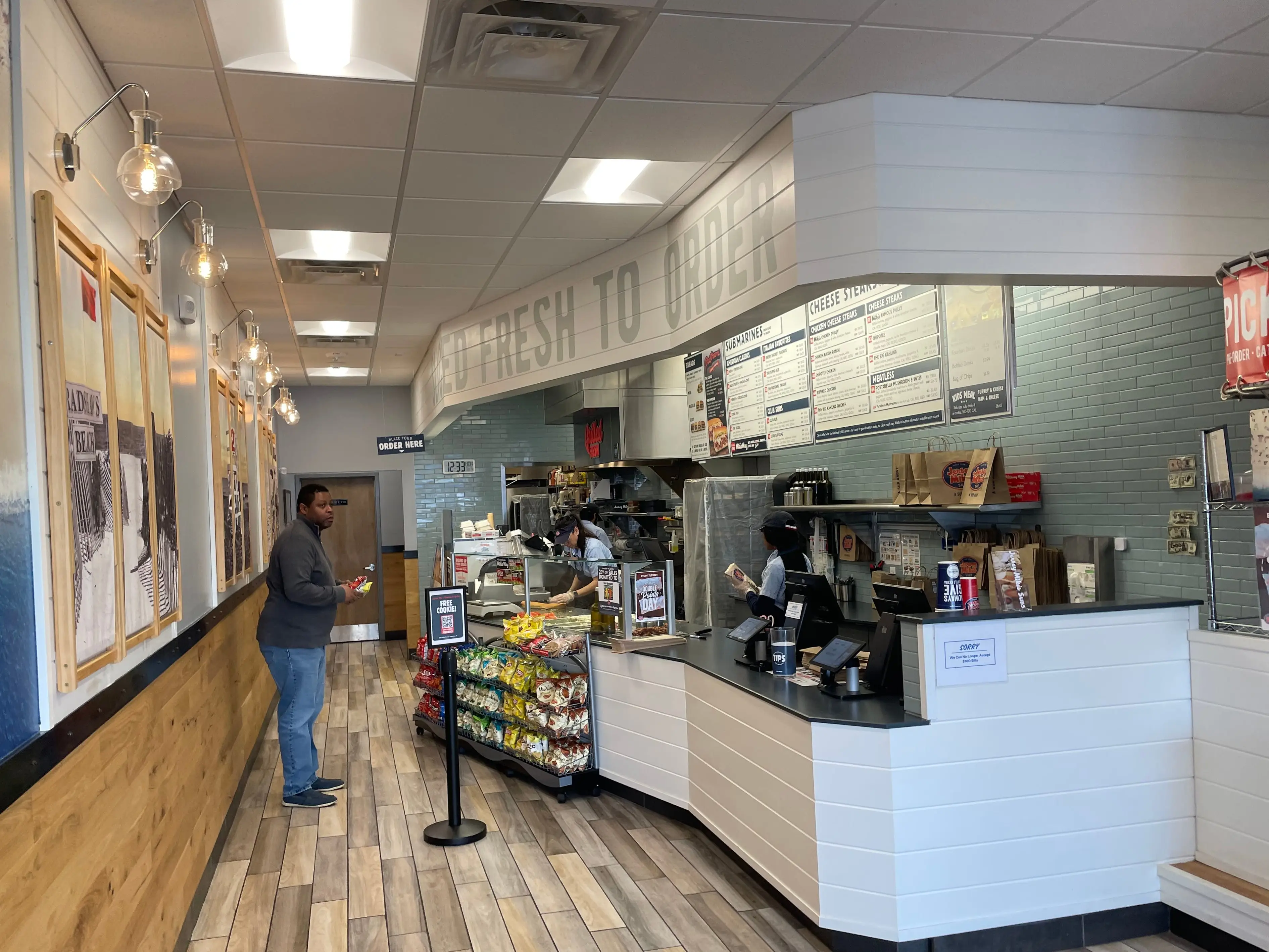 A customer inside a Jersey Mike's sandwich shop.