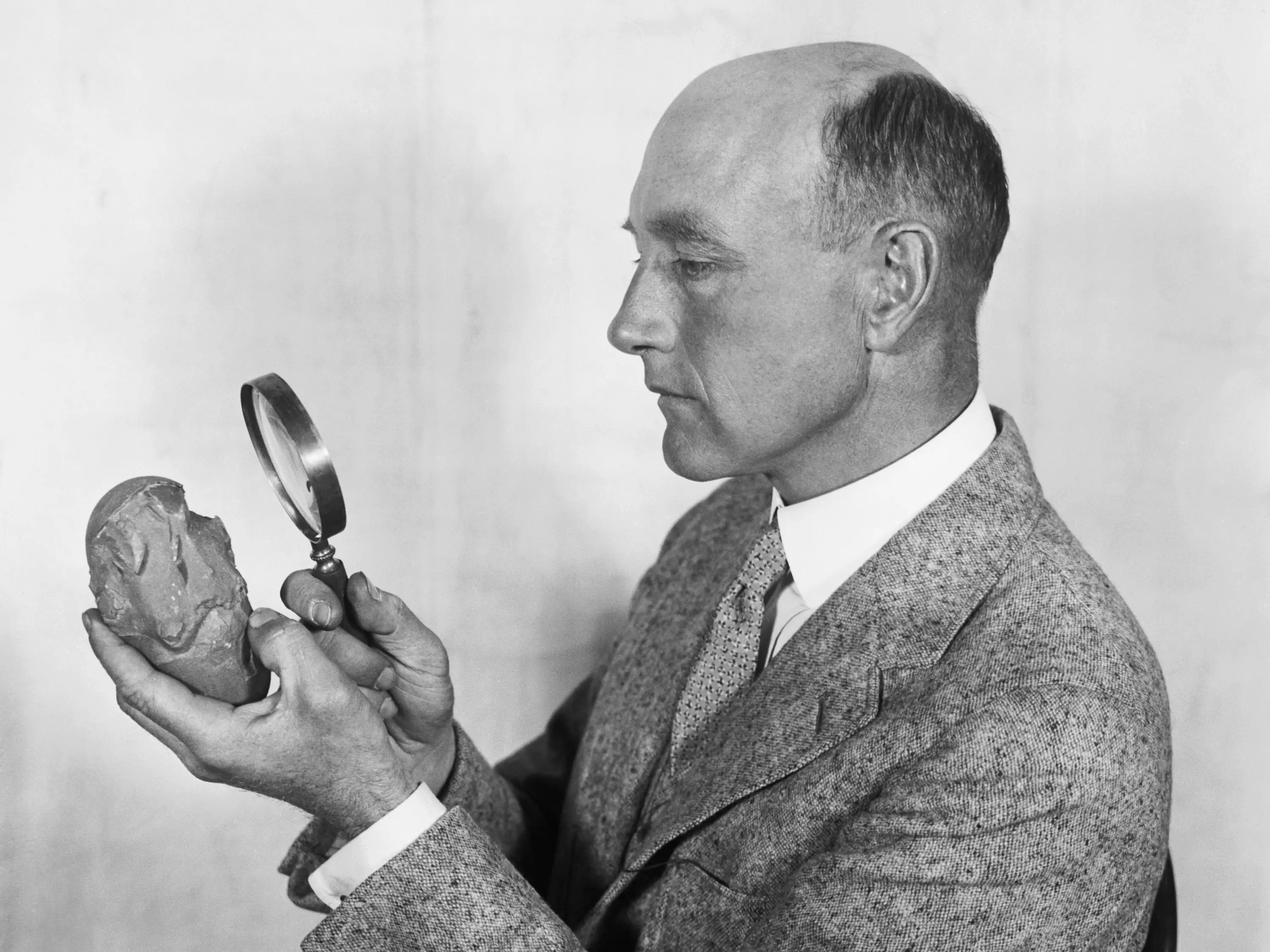 Roy Chapman Andrews Looking at Egg
