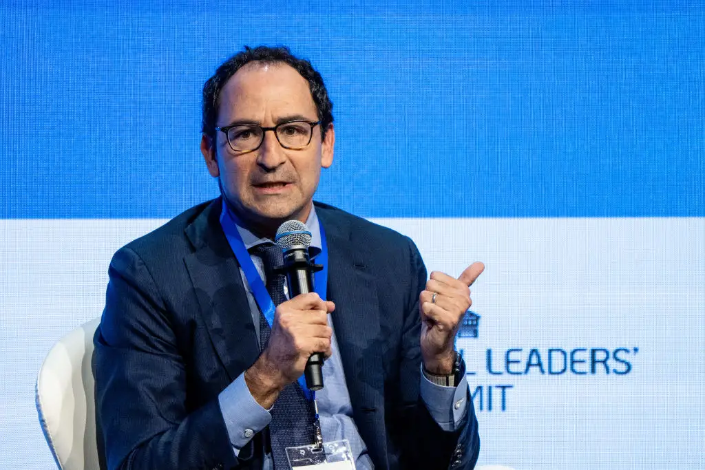 Jon Gray holding a mic at an investor conference