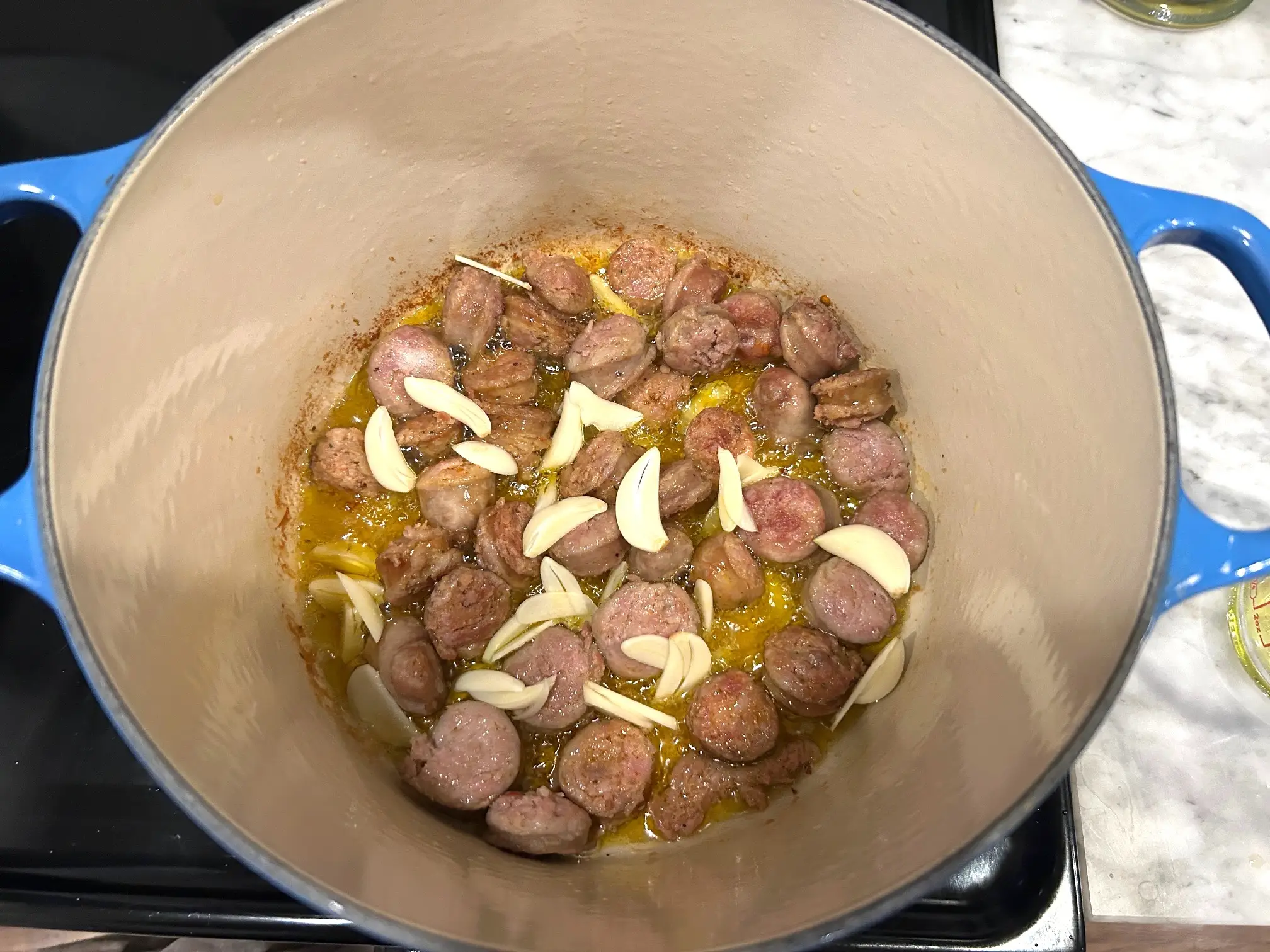 Adding garlic to sausage for Ina Garten's sausage orecchiette