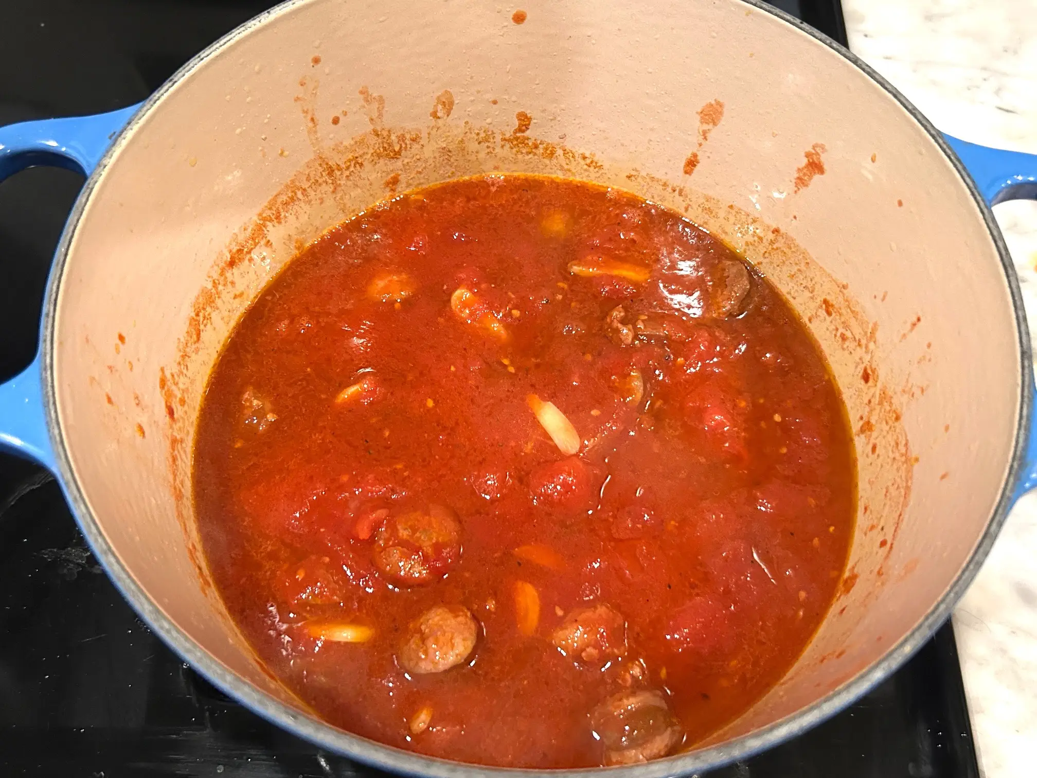 Tomato sauce in pot for Ina Garten's sausage orecchiette