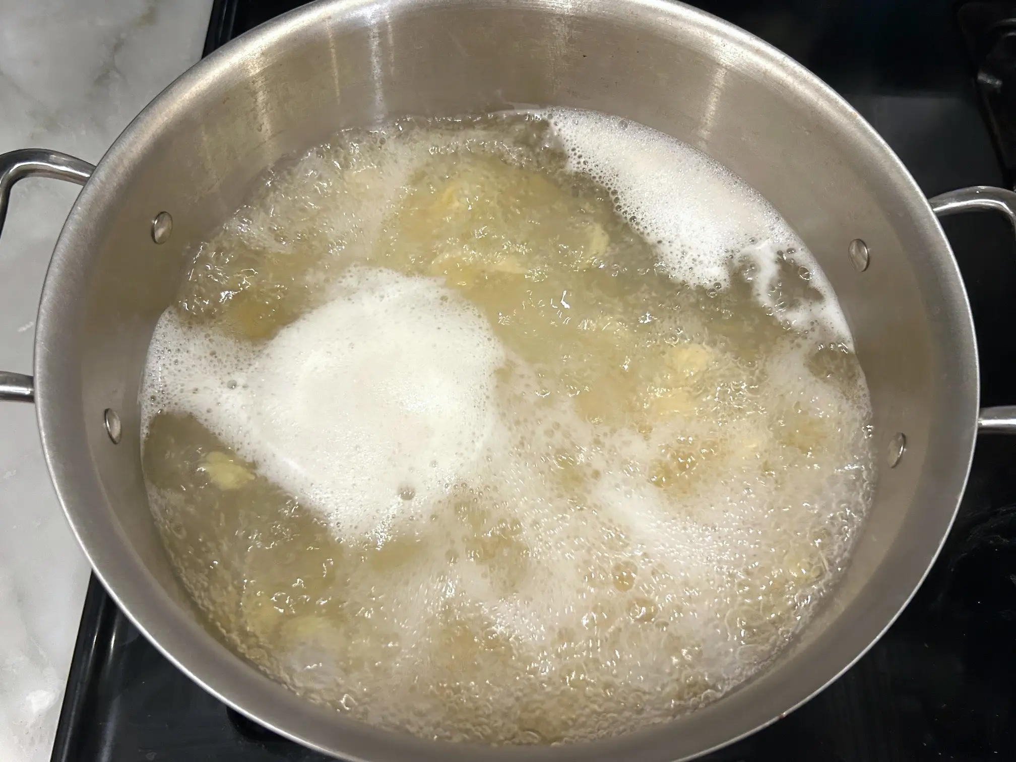 Boiling pasta for Ina Garten's sausage orecchiette