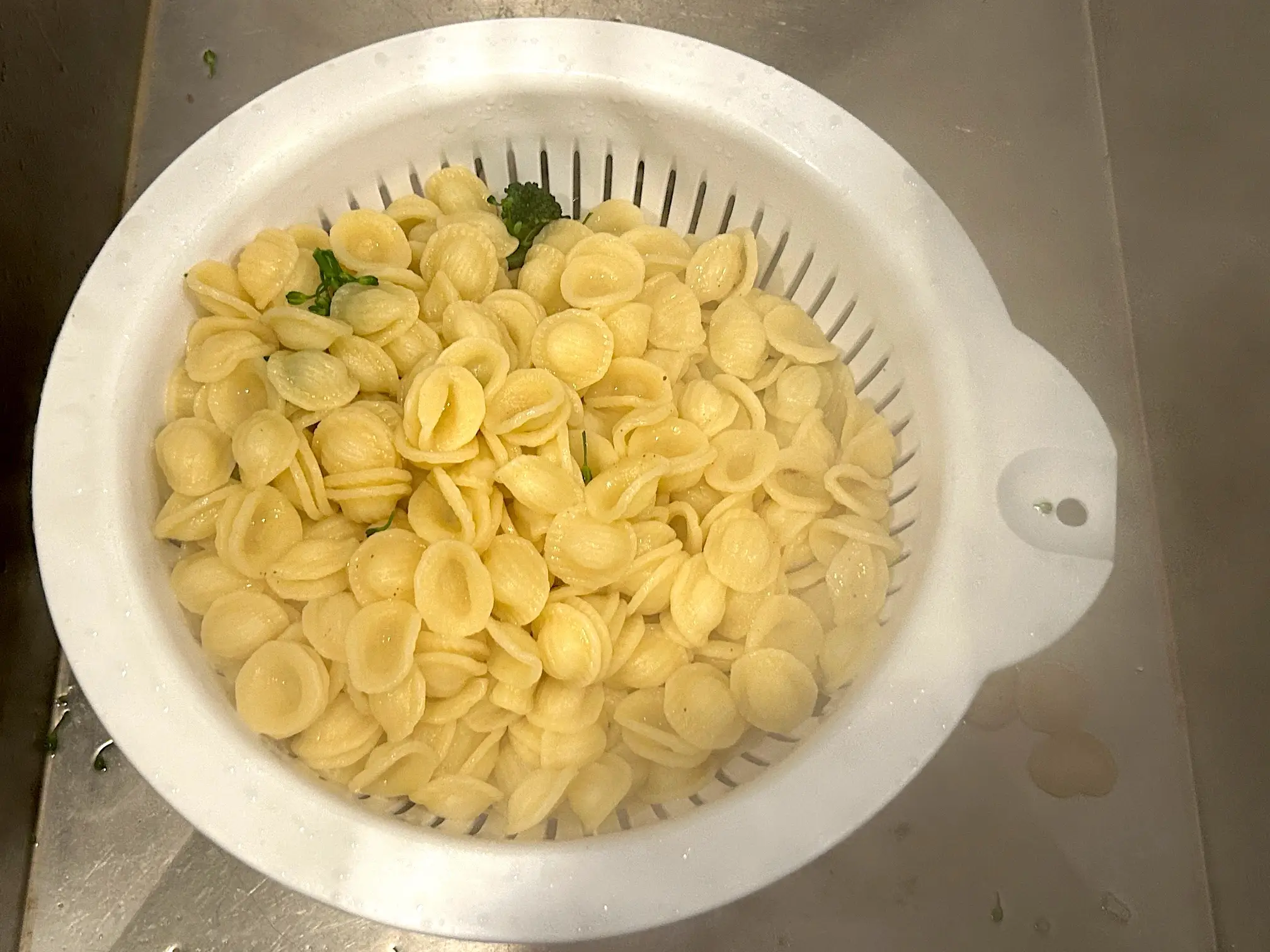 Draining pasta for Ina Garten's sausage orecchiette