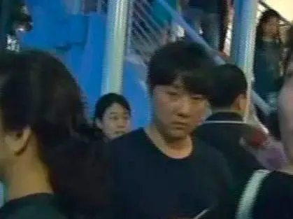 Reportedly Kim Jong Chol in a black t-shirt in a crowd