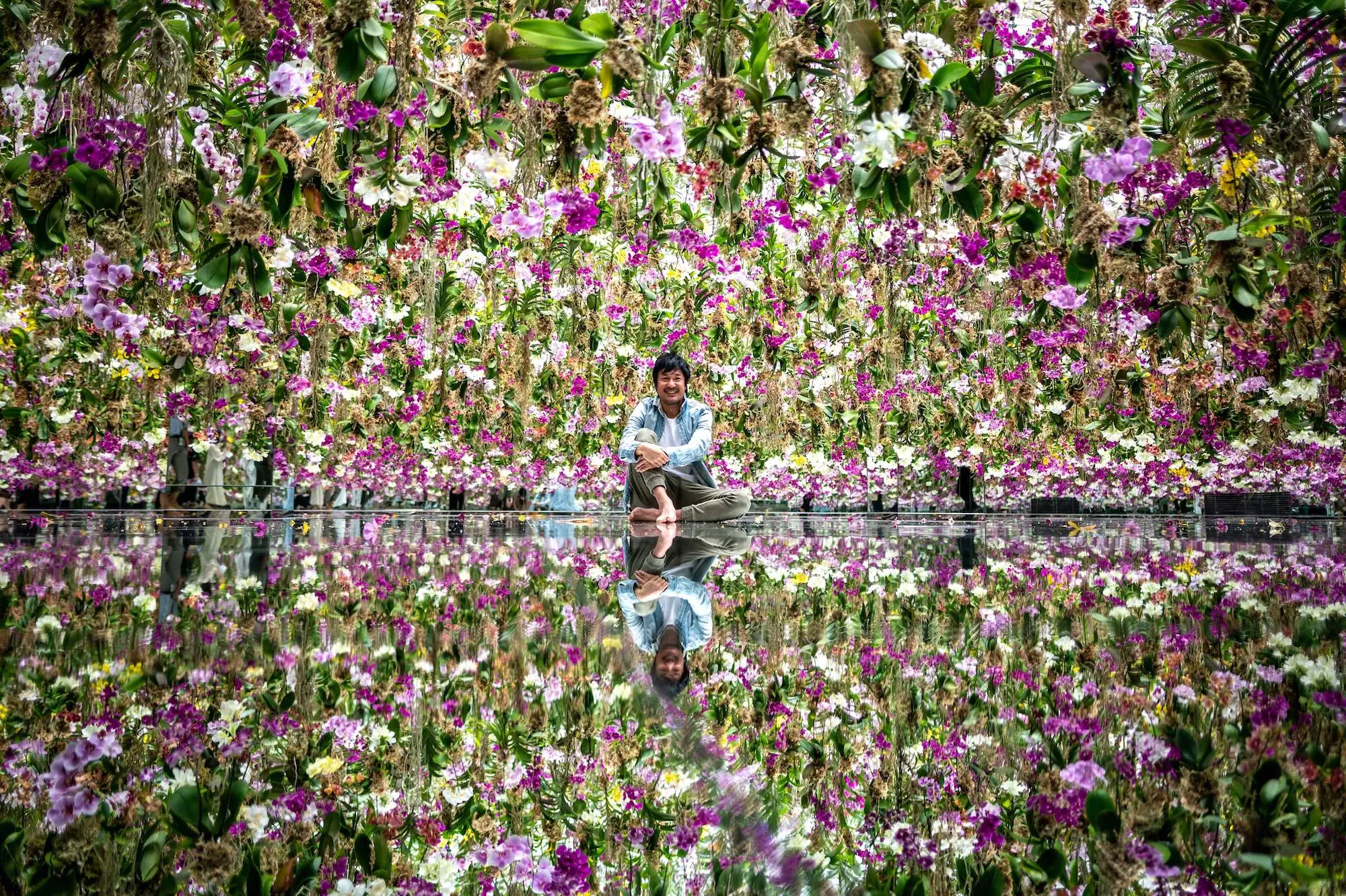 Toshiyuki Inoko, the founder of TeamLab, in the floating flower garden.