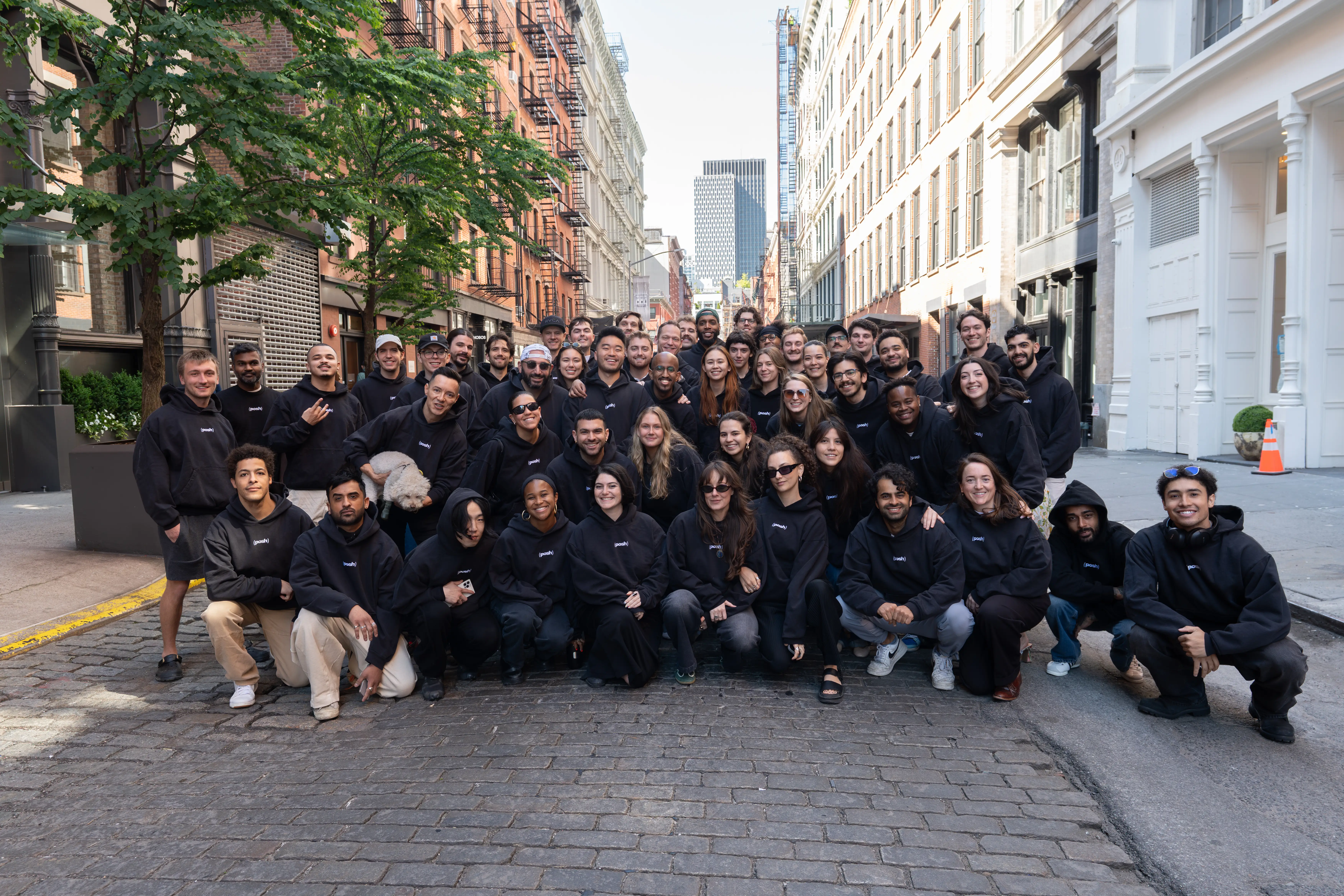 Team photo of Posh startup in SoHo alley
