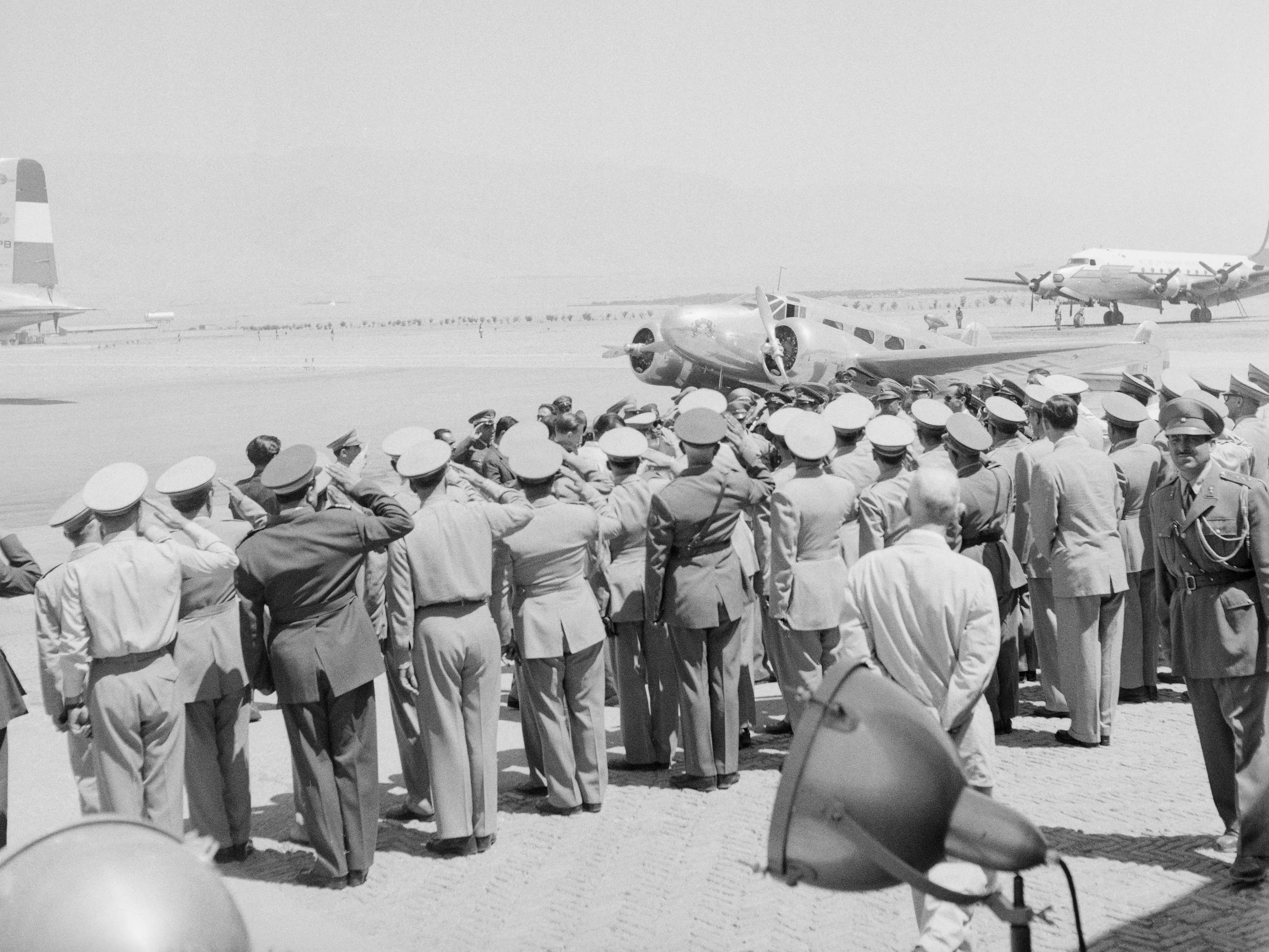 Iranian army officers and honor guards greeted Shah Mohammed Reza Pahlavi at the Tehran airport upon his return.