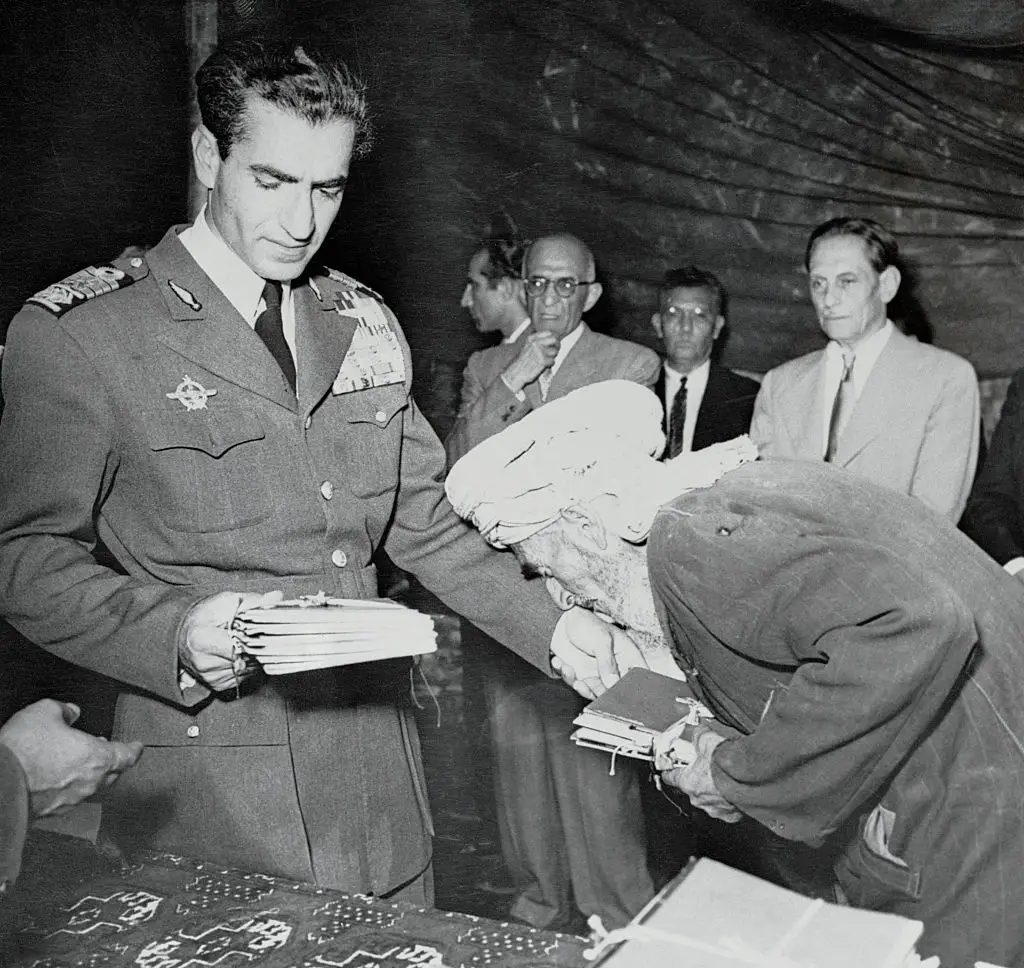 The Shah of Iran distributed land titles to peasants.