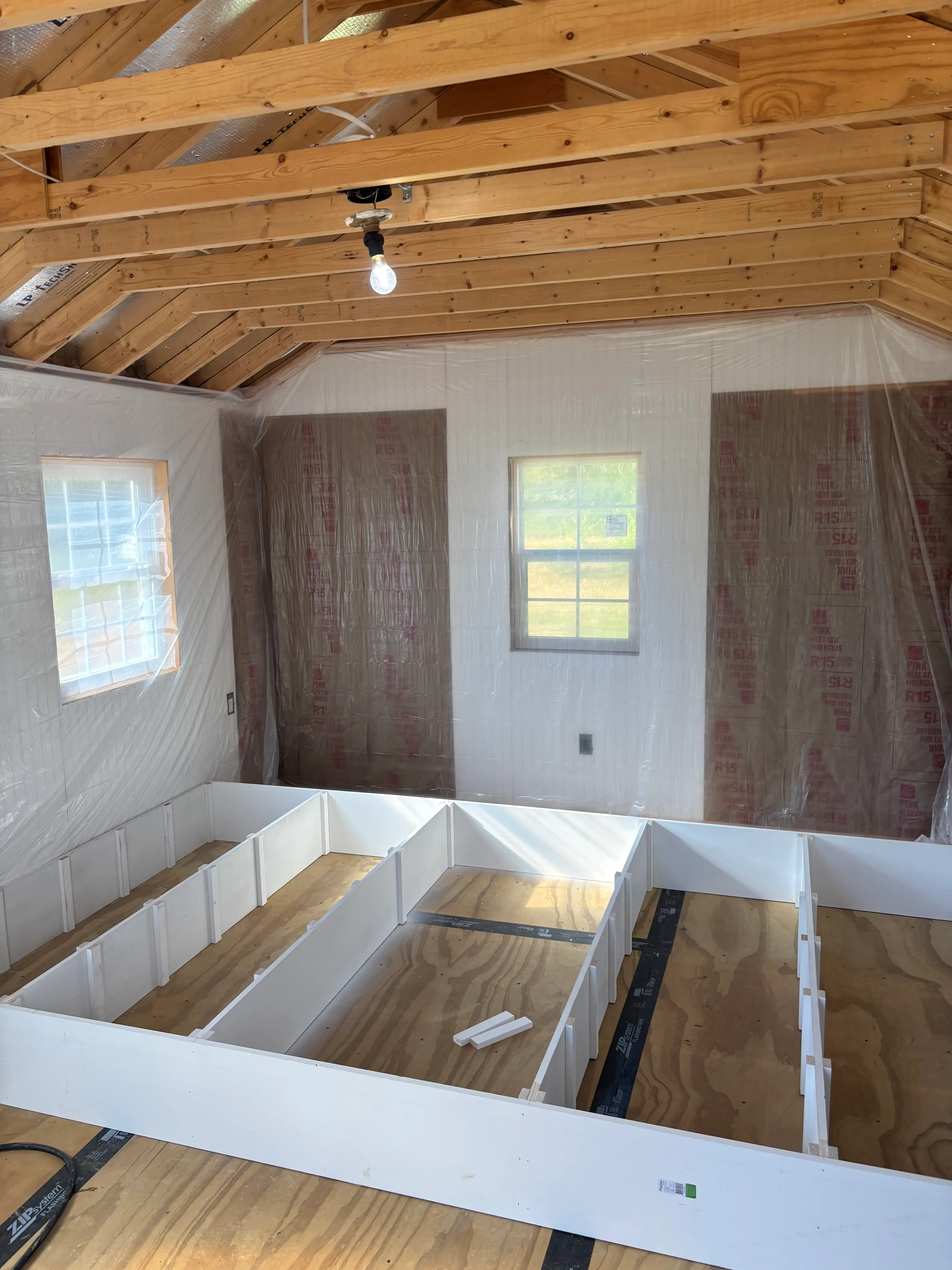Bookshelves being built inside Jess Ciesla's library shed.
