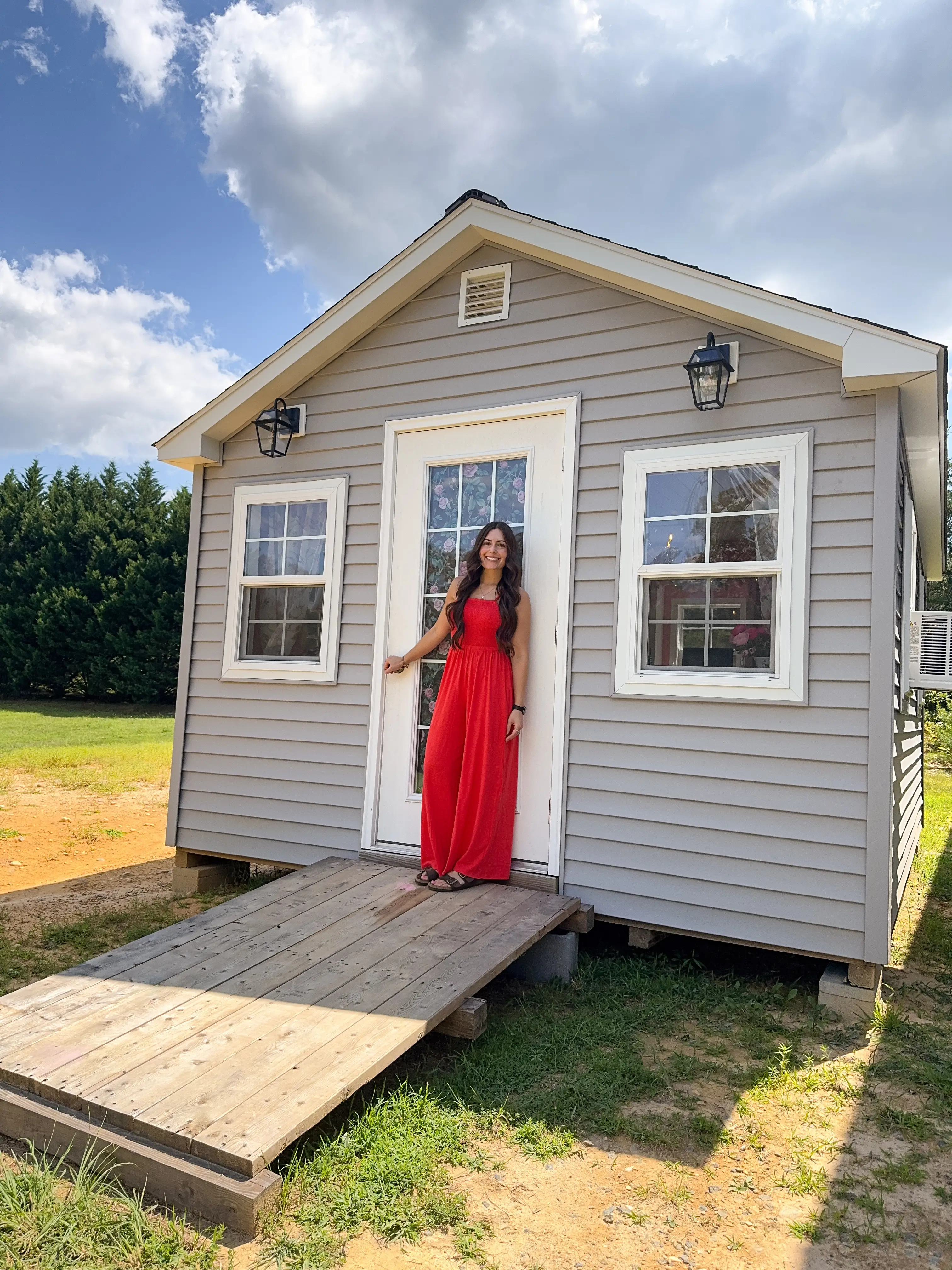 Jess Ciesla stands outside her library shed.