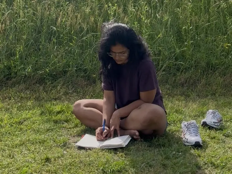 Namrata Yadav writing in nature.