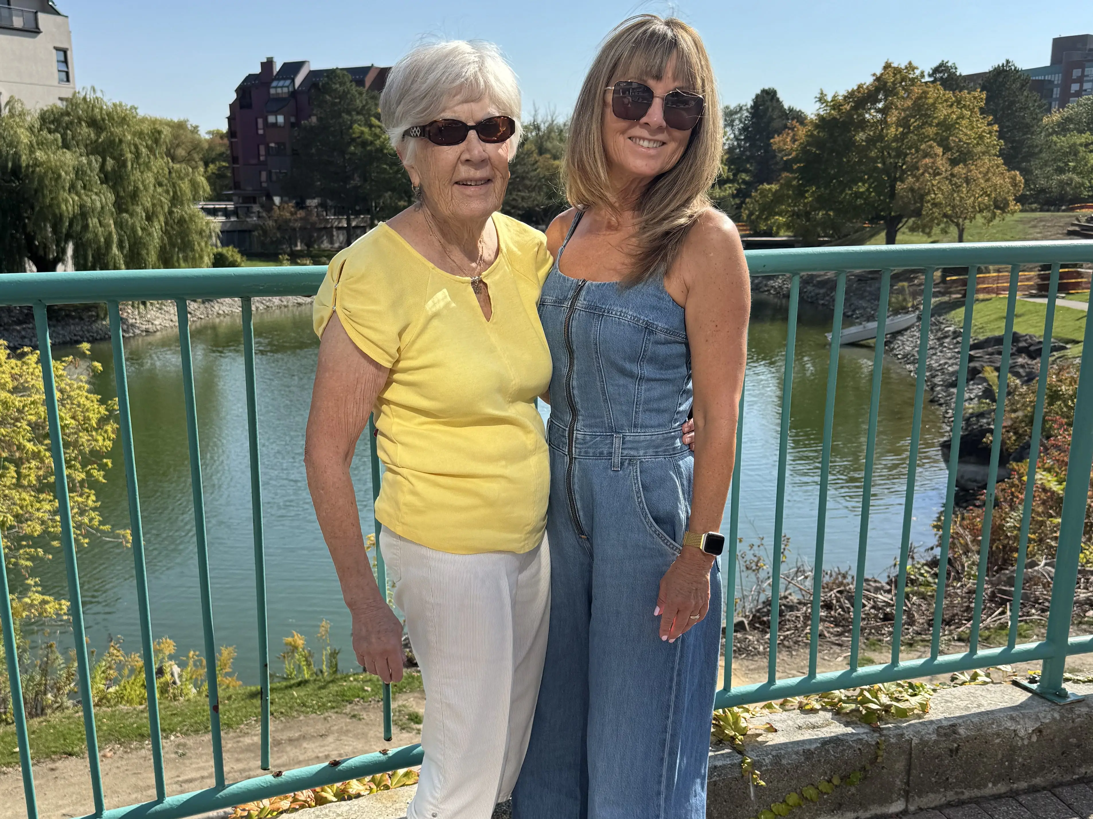 janet osborne and her mother posing side by side on bridge