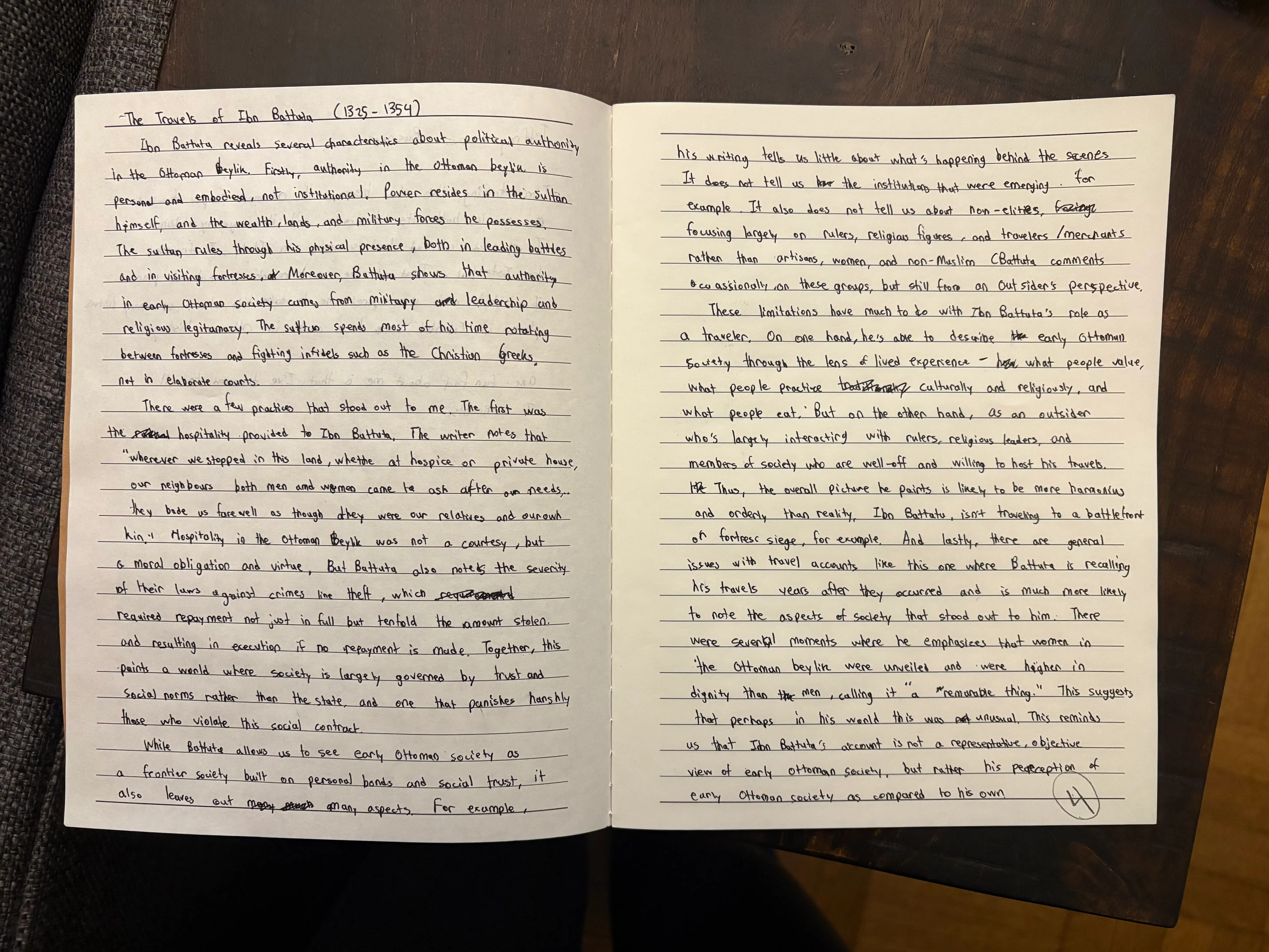 Double-page spread of notebook with history assignment written in it.