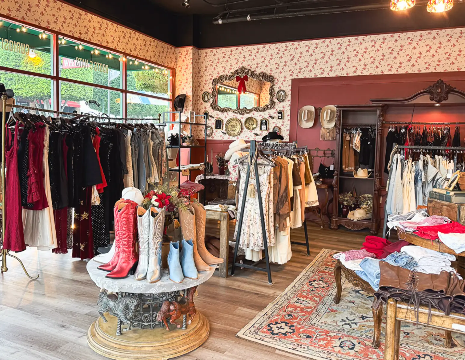 Dresses and cowboy boots in the interior of the writer's store.