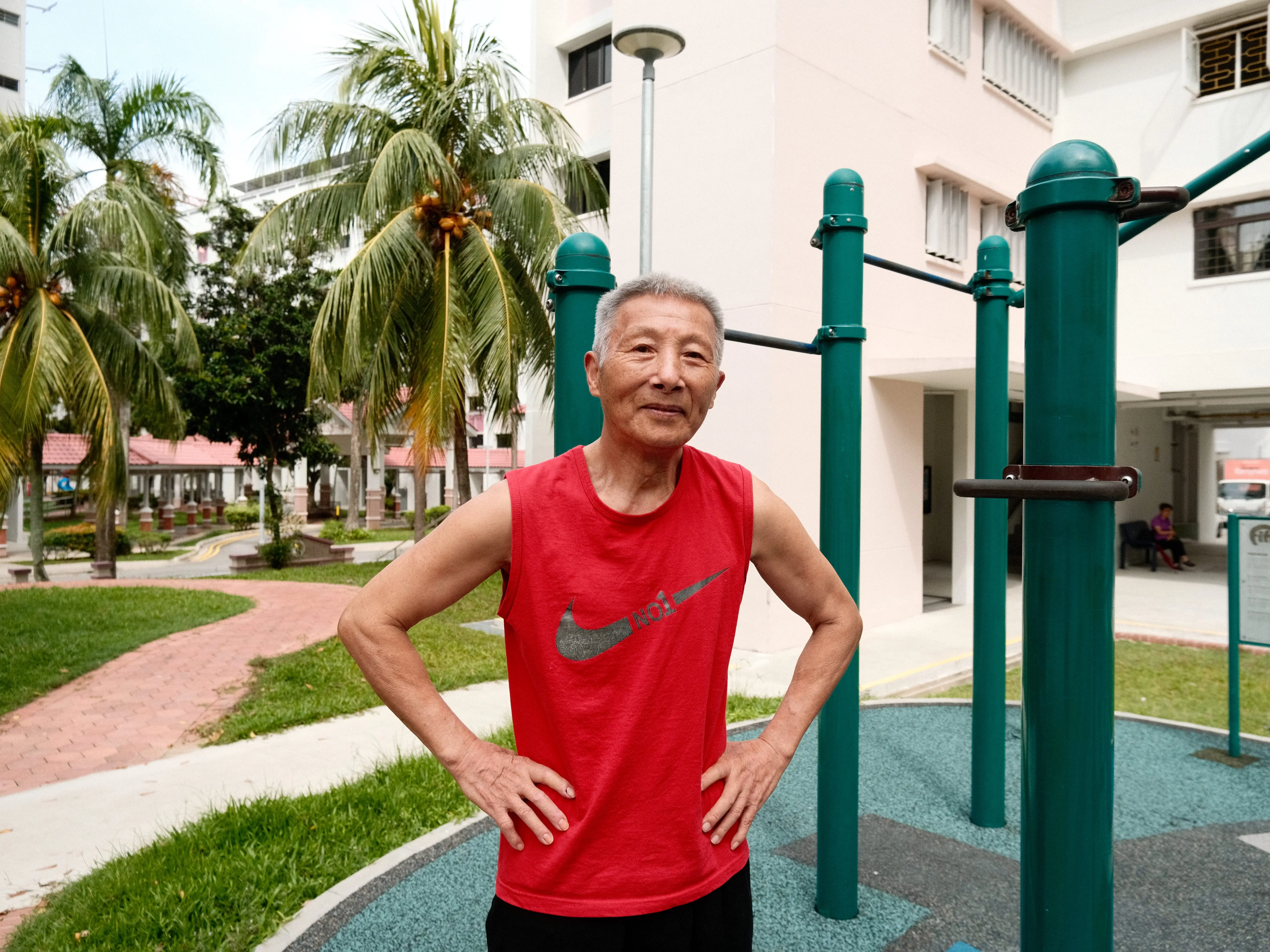 A man posing at a fitness corner in Singapore.