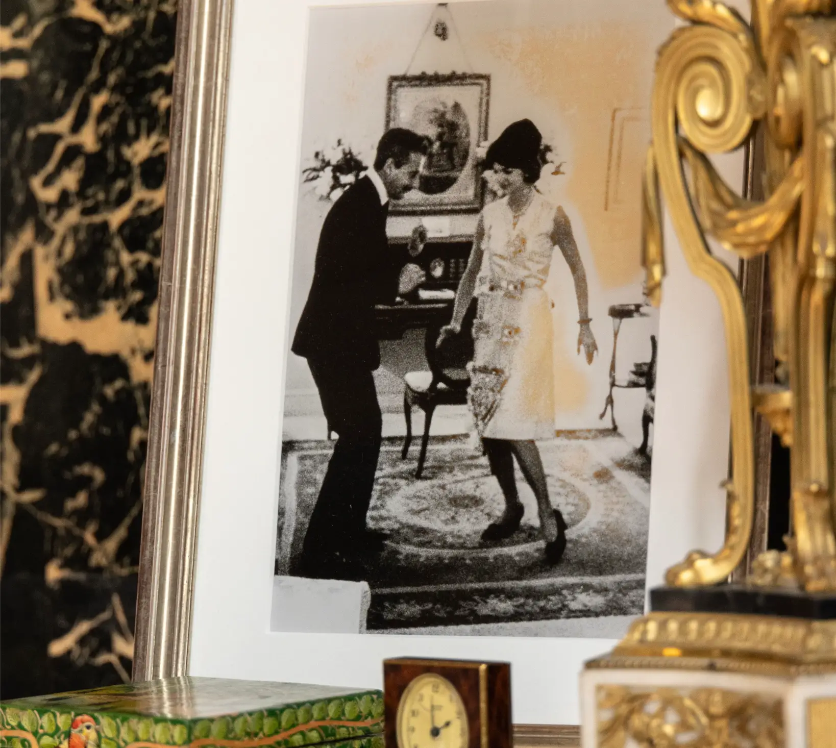 A fireplace mantle featured a photo of fashion designer Oleg Cassini with longtime client Jacqueline Kennedy from back in her days as First Lady.