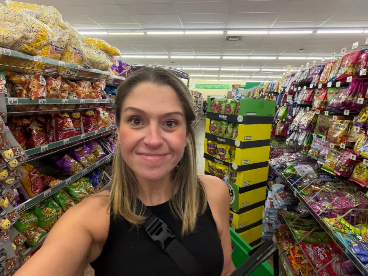 Author Terri Peters smiling in a Dollar Tree store