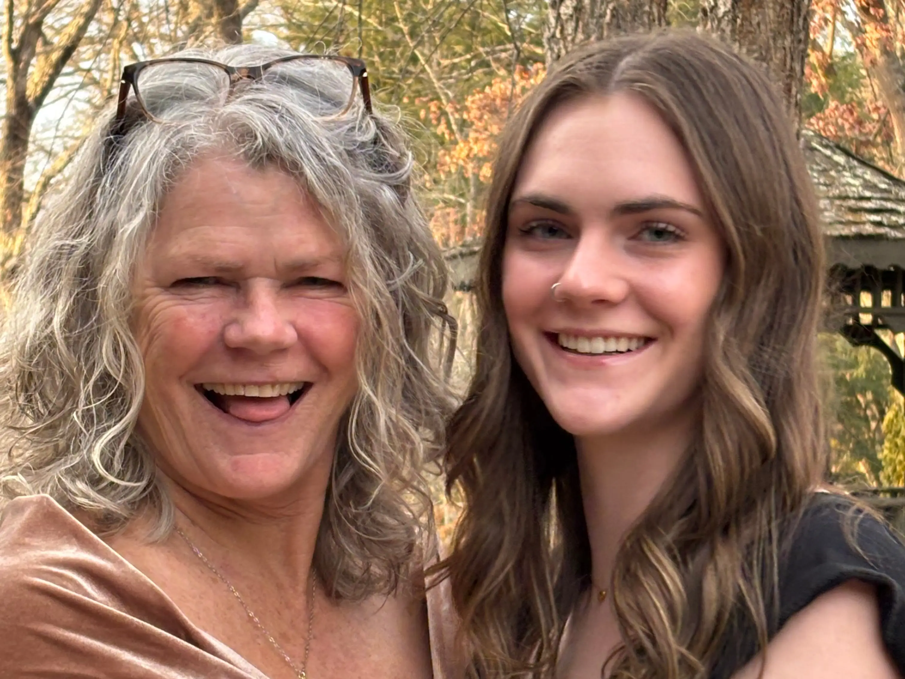 Mom and daughter posing for photo