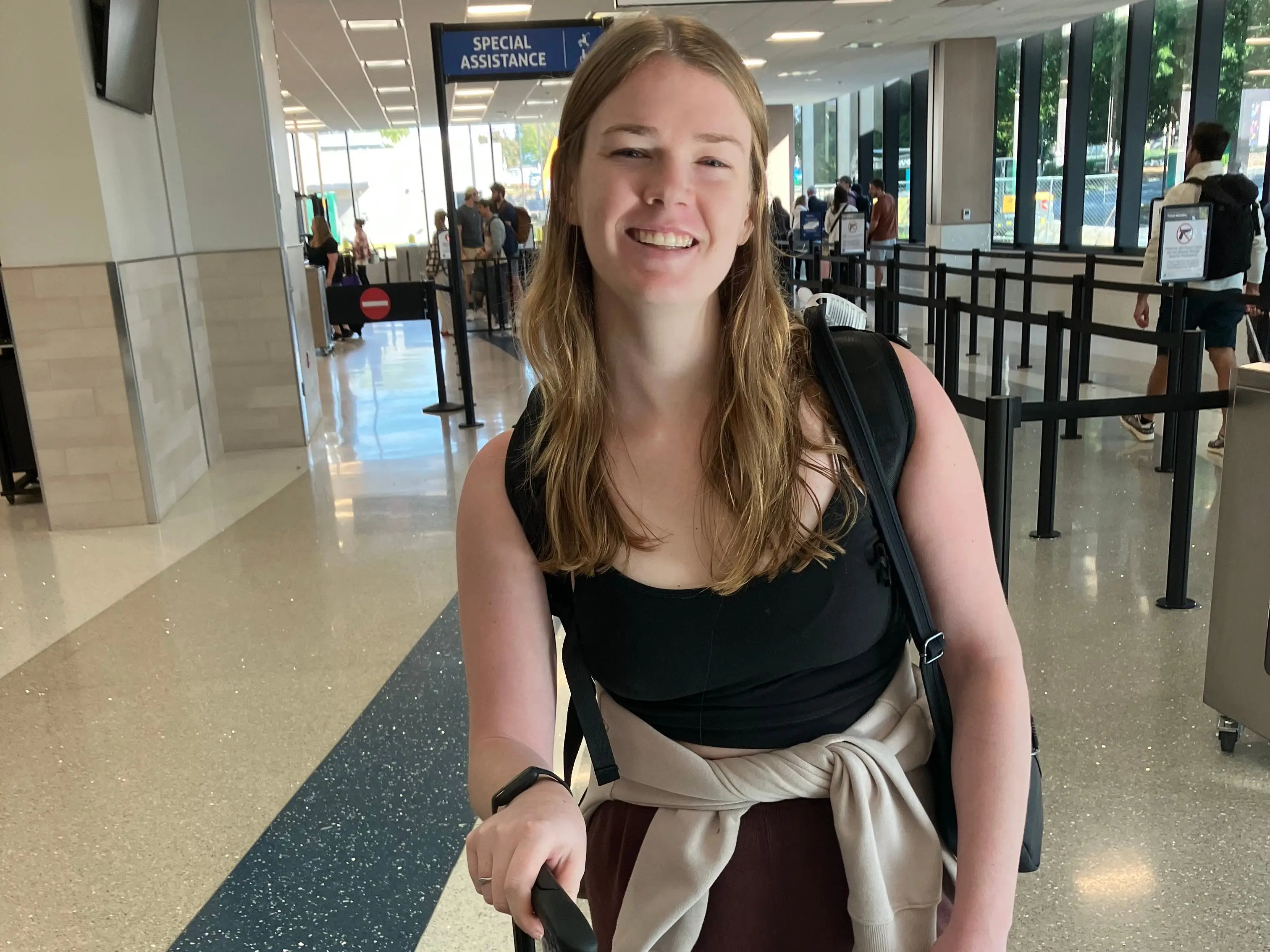 Woman at aiport posing for photo