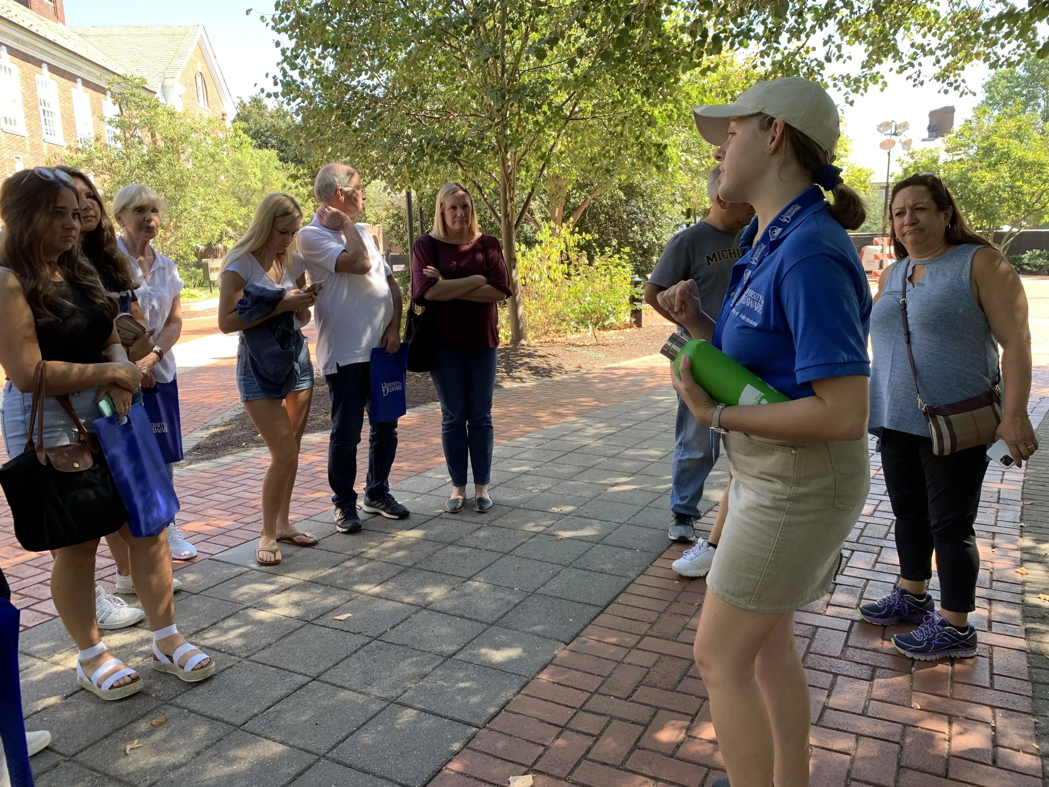 A tour guide stops to chat to a group of prospective college students on the campus of the University of Delaware in Newark