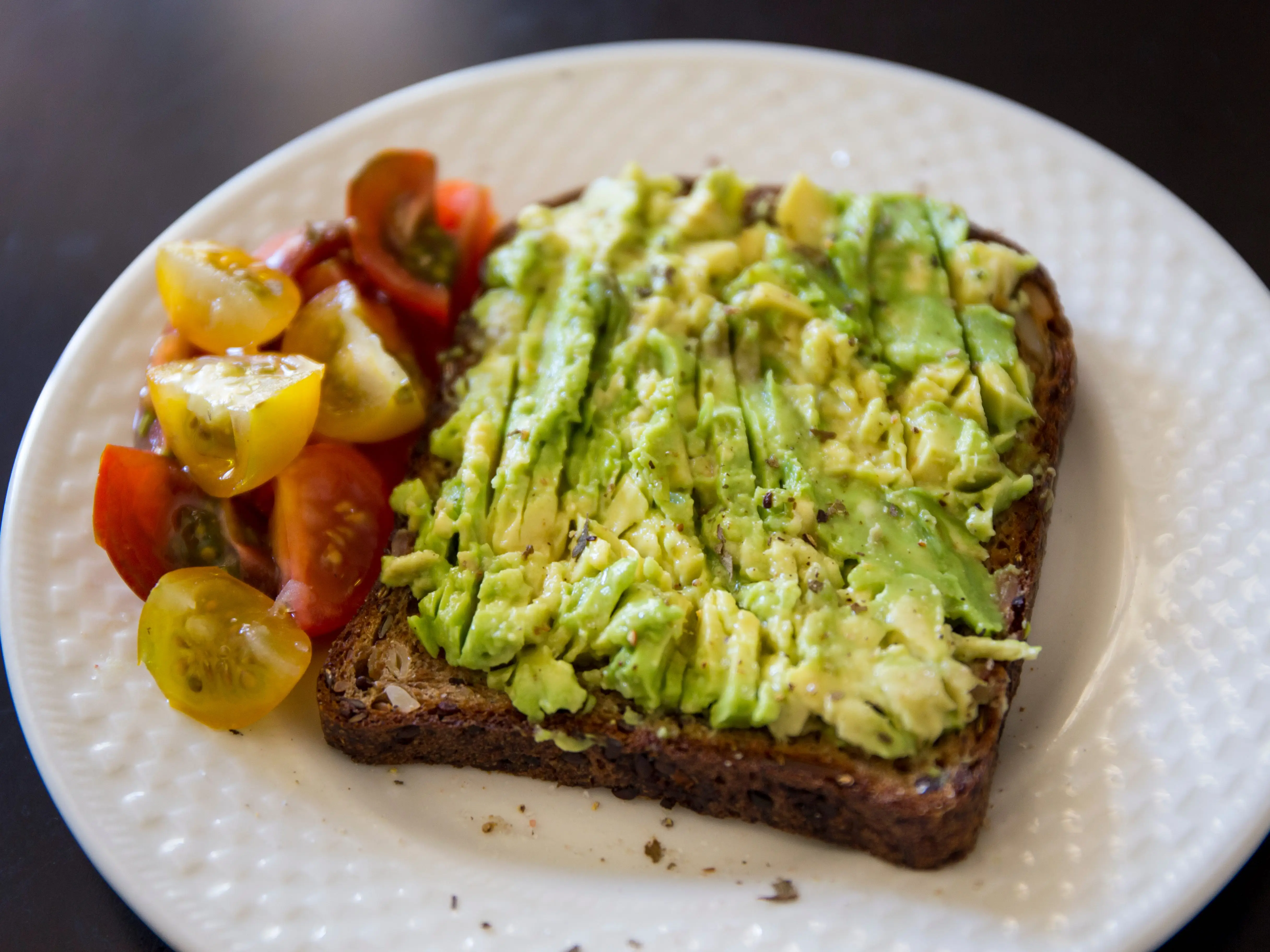 Avocado toast and a side of diced tomatoes
