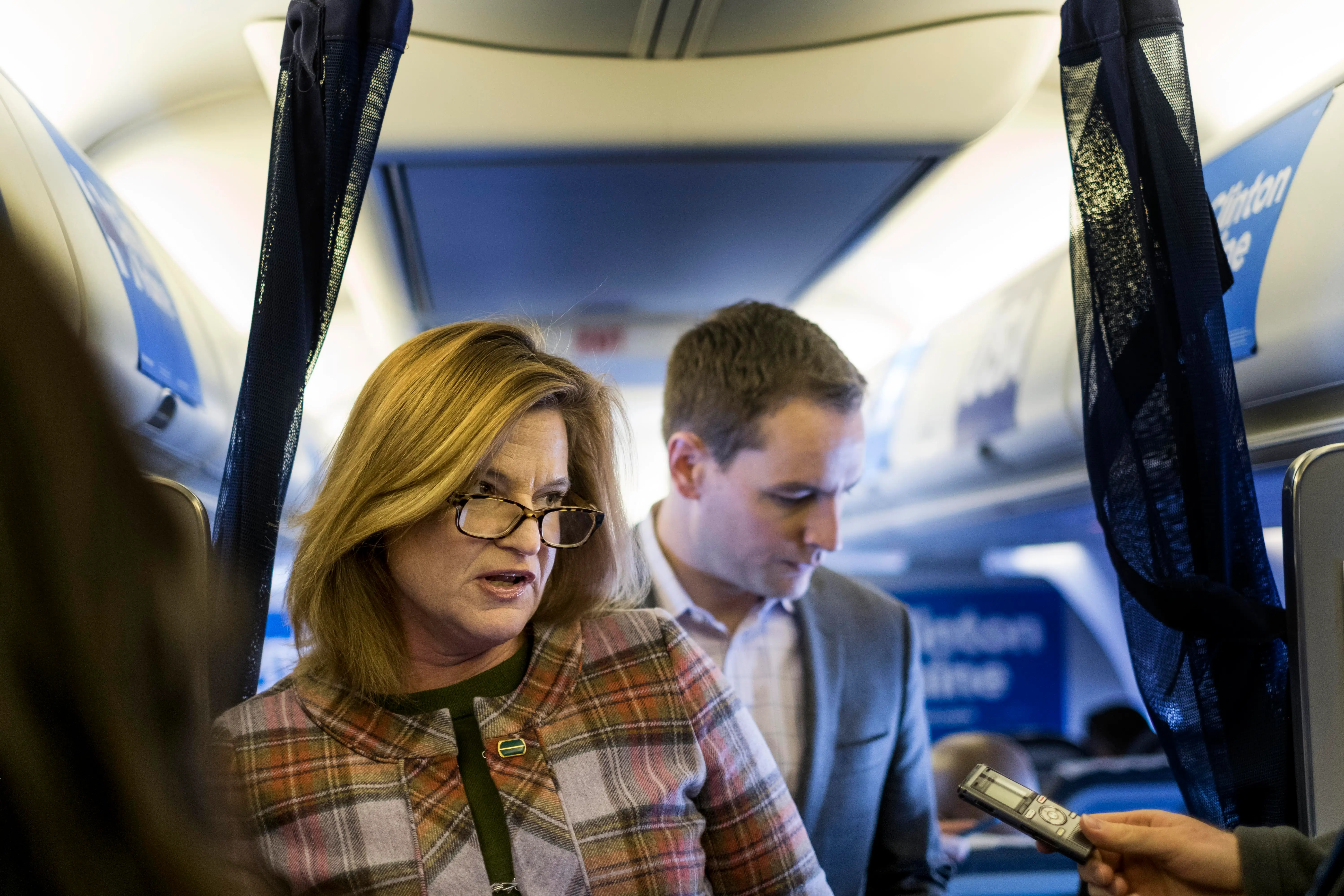 People inside Hillary Clinton's campaign plane.