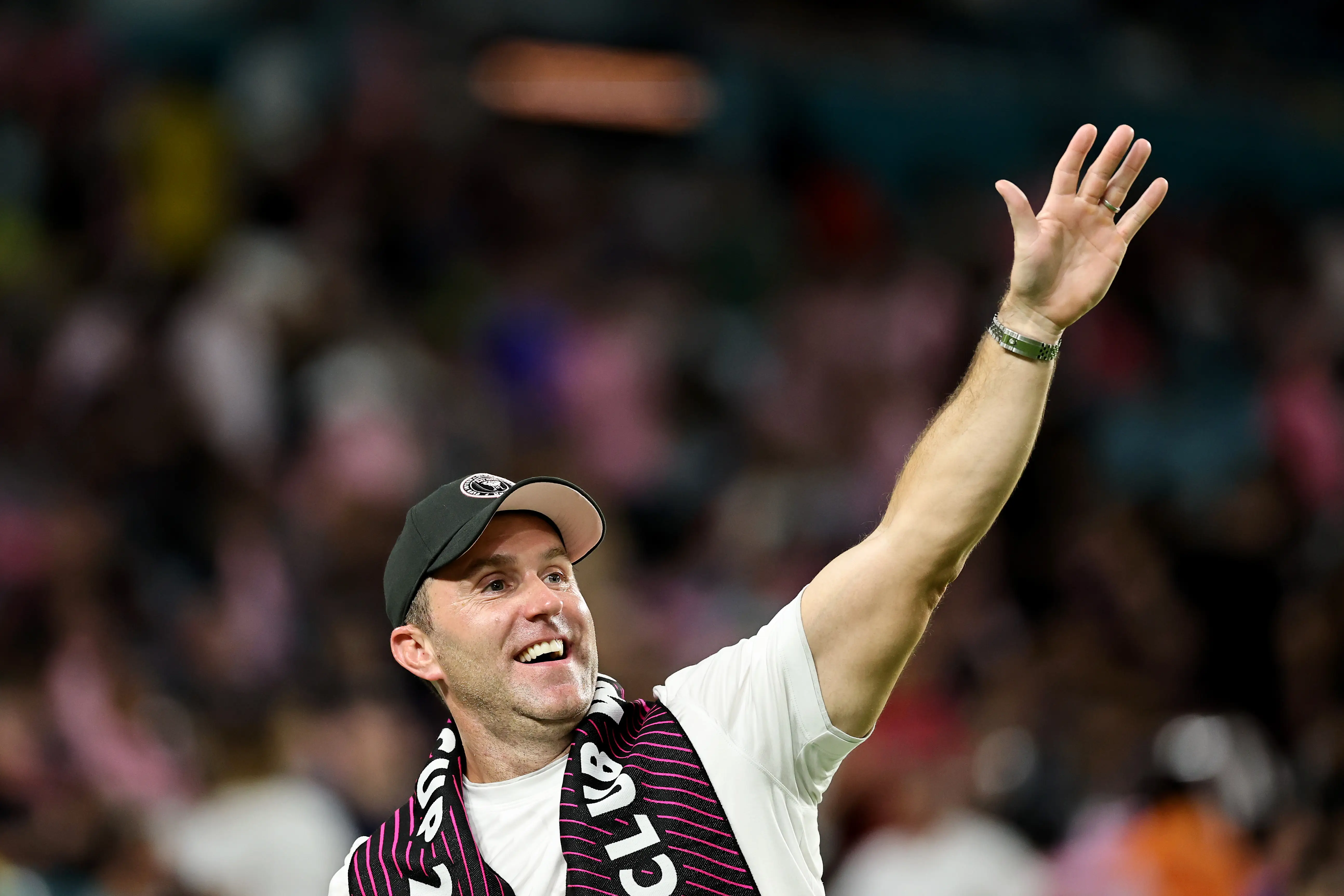 Matthew Caldwell, CEO of the Minnesota Timberwolves NBA franchise raises his hand in joy