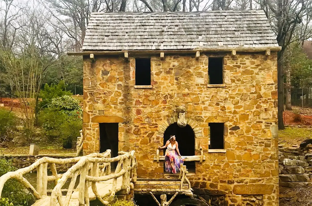 The writer posing in front of Old Mill in Little Rock, Arkansas.