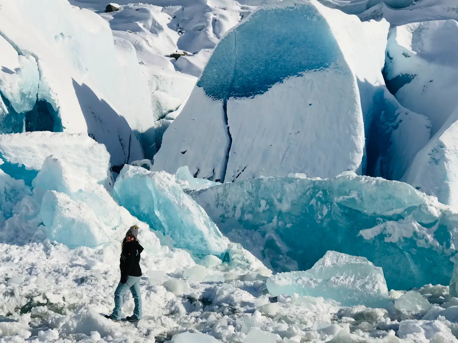 The writer standing in front of a glacier in Juneau, Alaska.